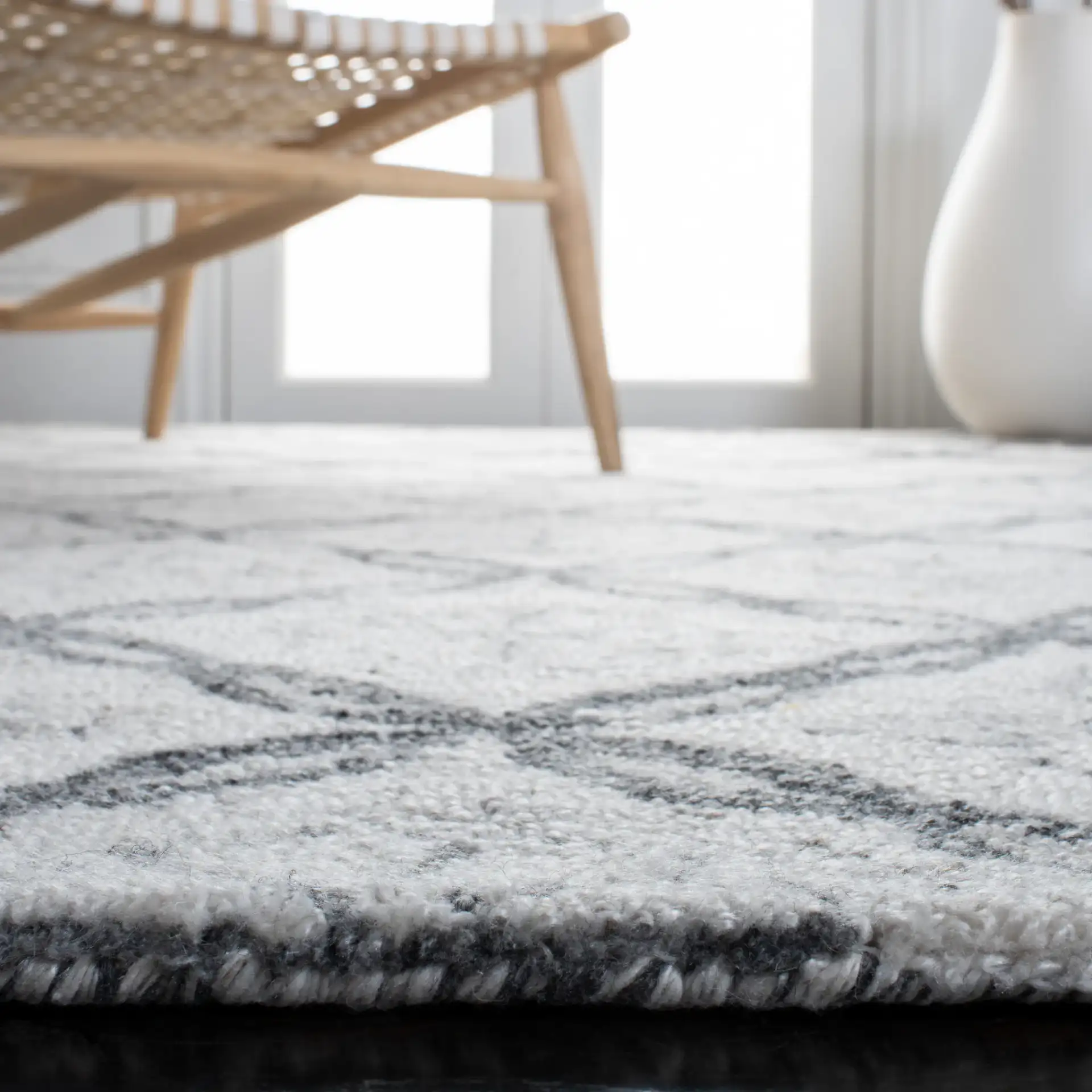 Marquee Floral Trellis Hand-Tufted Rug in Ivory / Gray in a styled room