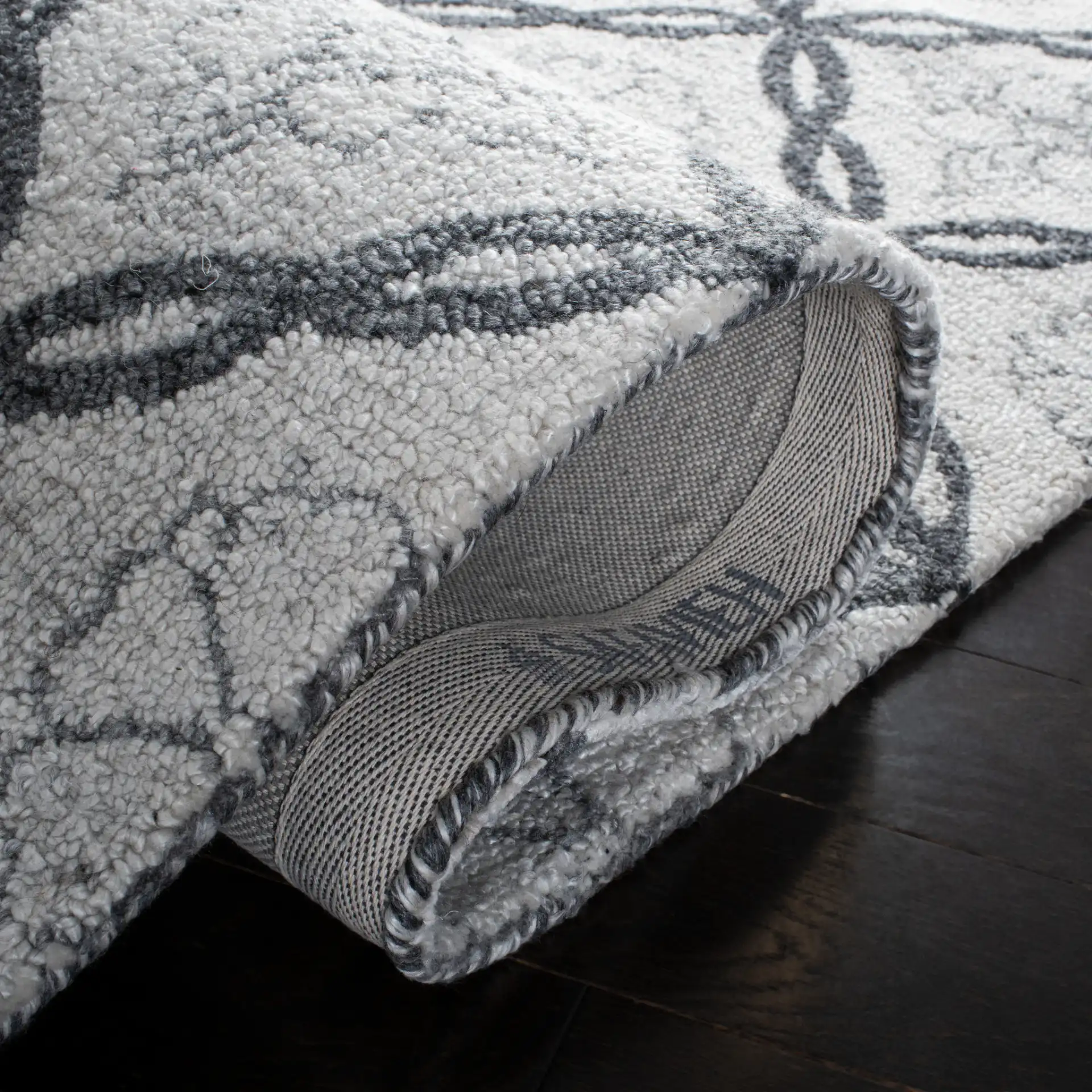 Marquee Floral Trellis Hand-Tufted Rug in Ivory / Gray in a styled room
