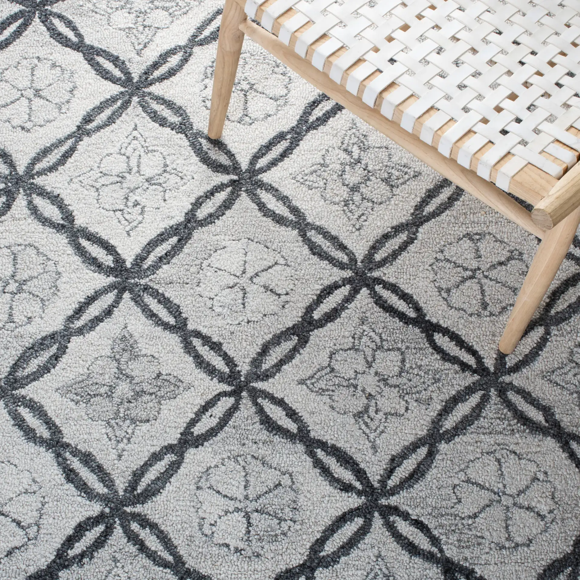 Marquee Floral Trellis Hand-Tufted Rug in Ivory / Gray in a styled room