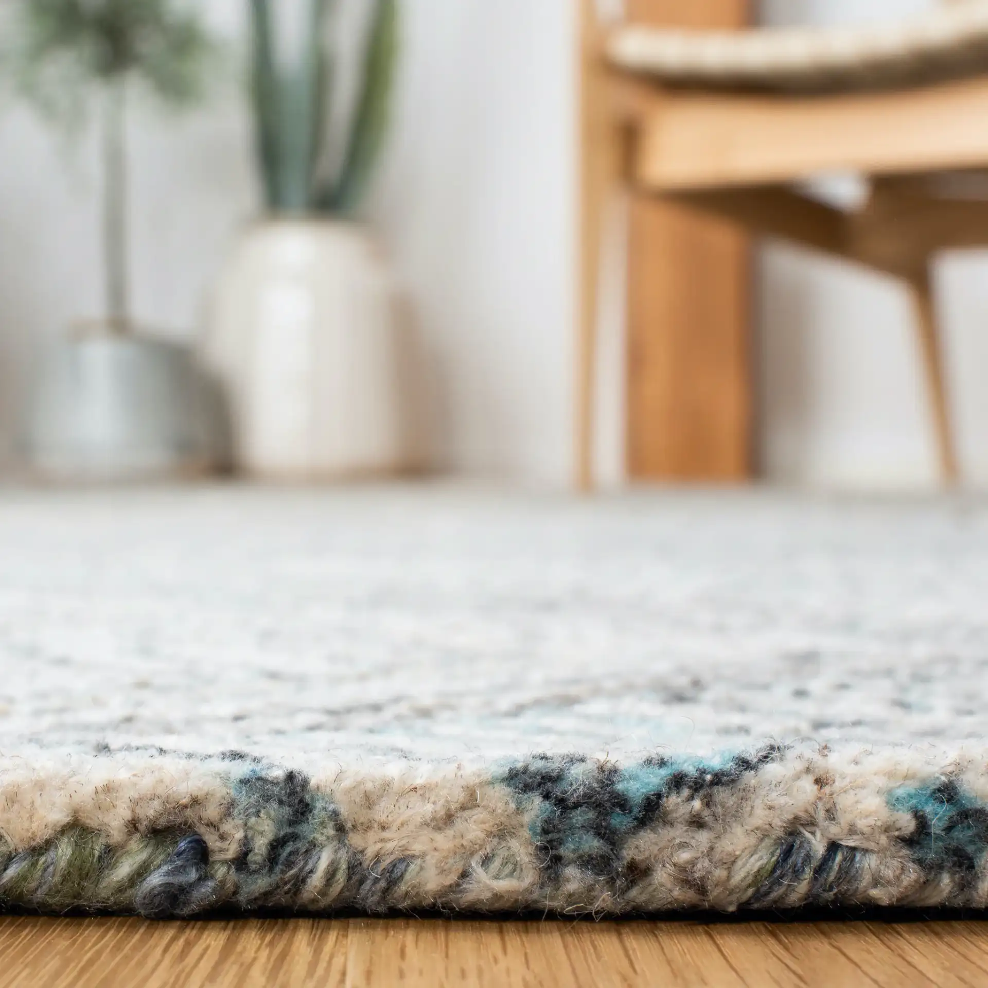 Marquee Concentric Diamond Hand-Tufted Rug in Turquoise / Beige in a styled room