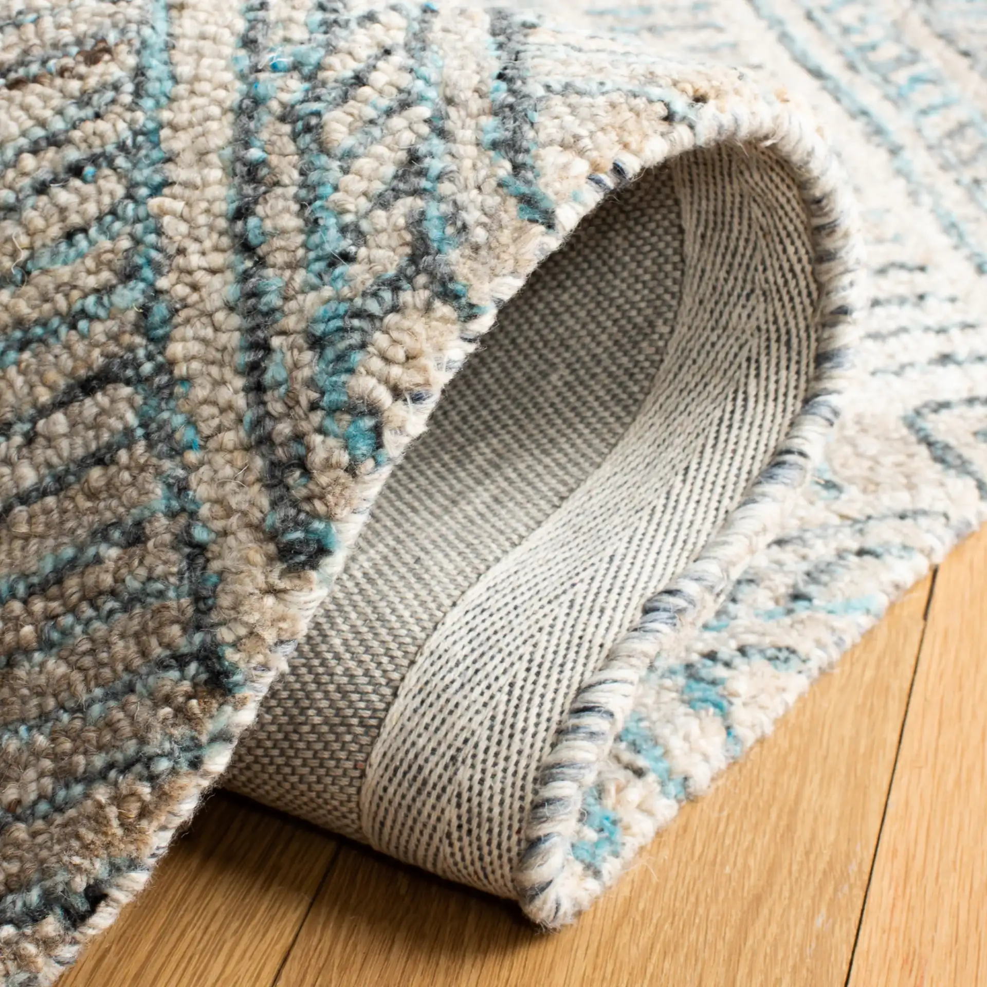 Marquee Concentric Diamond Hand-Tufted Rug in Turquoise / Beige in a styled room