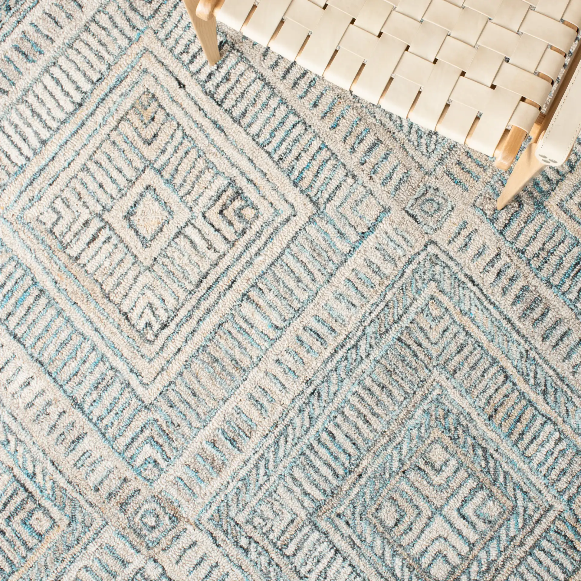 Marquee Concentric Diamond Hand-Tufted Rug in Turquoise / Beige in a styled room