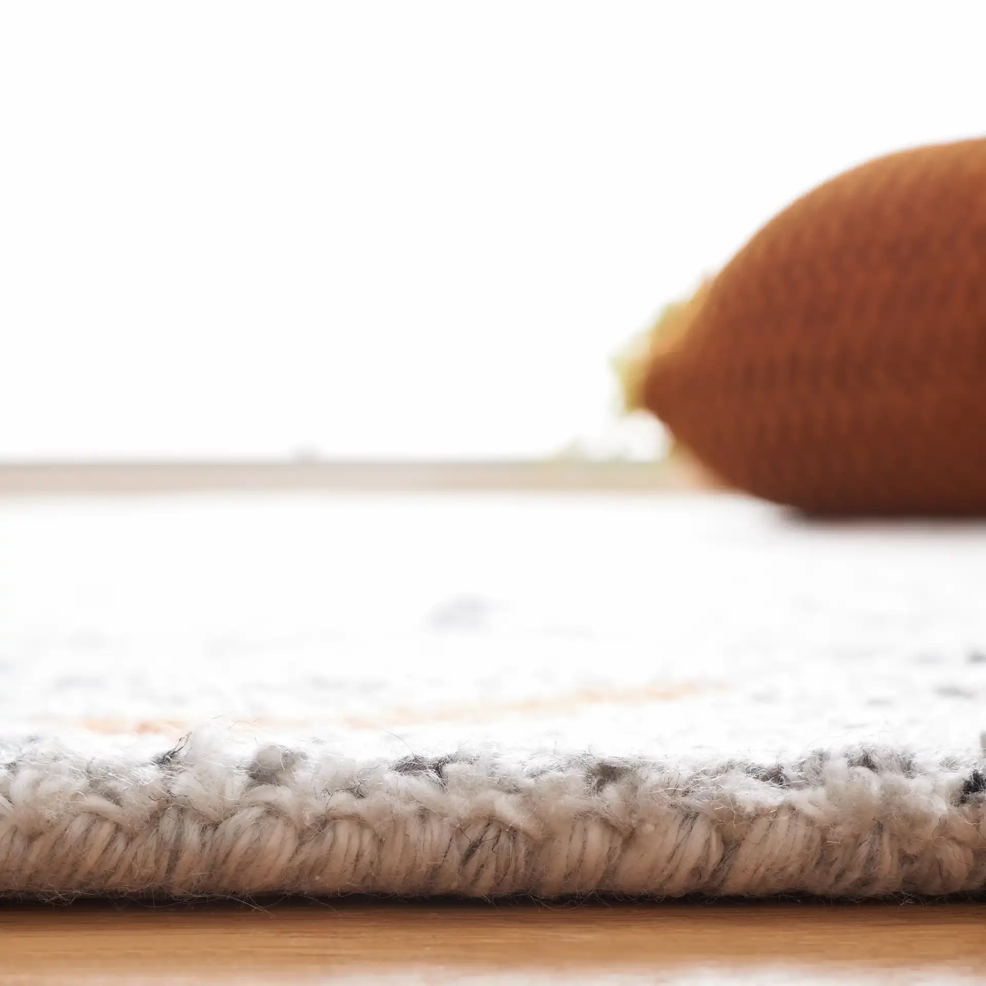Marquee Tribal Diamond Hand-Tufted Rug in Rust / Gray in a styled room