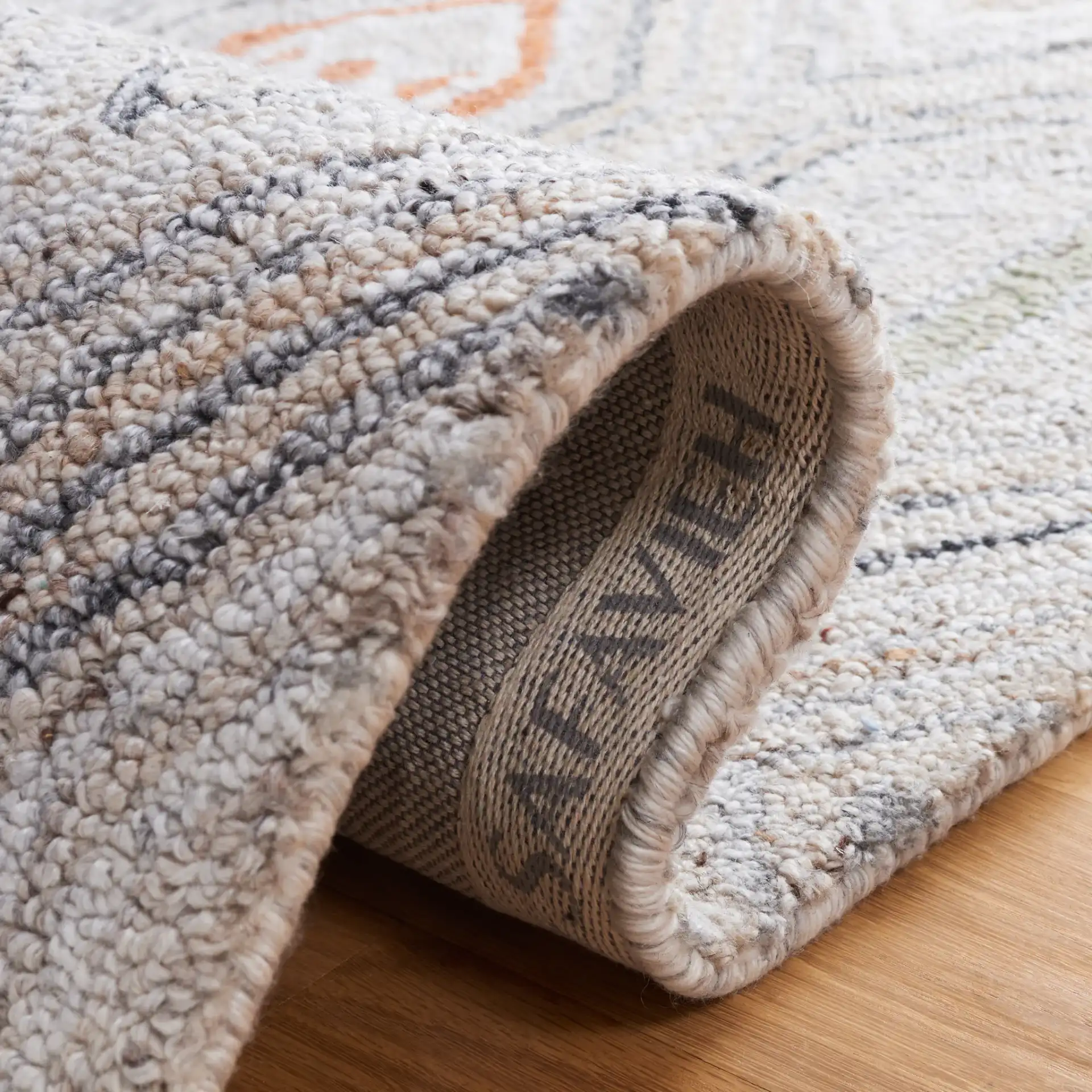 Marquee Tribal Diamond Hand-Tufted Rug in Rust / Gray in a styled room