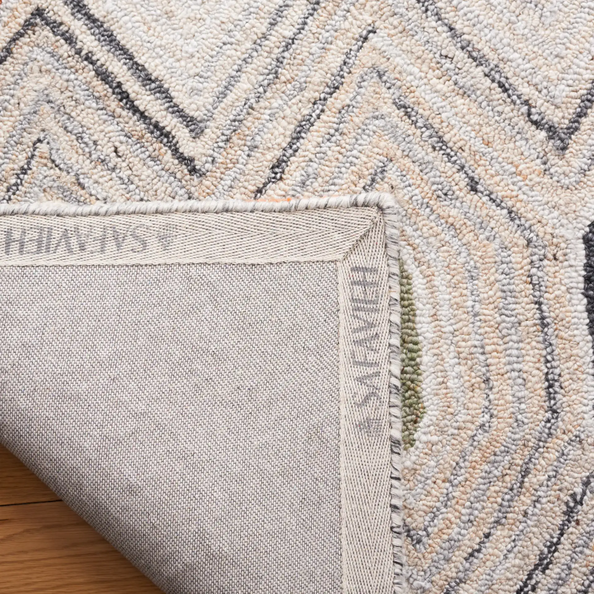 Marquee Tribal Diamond Hand-Tufted Rug in Rust / Gray in a styled room