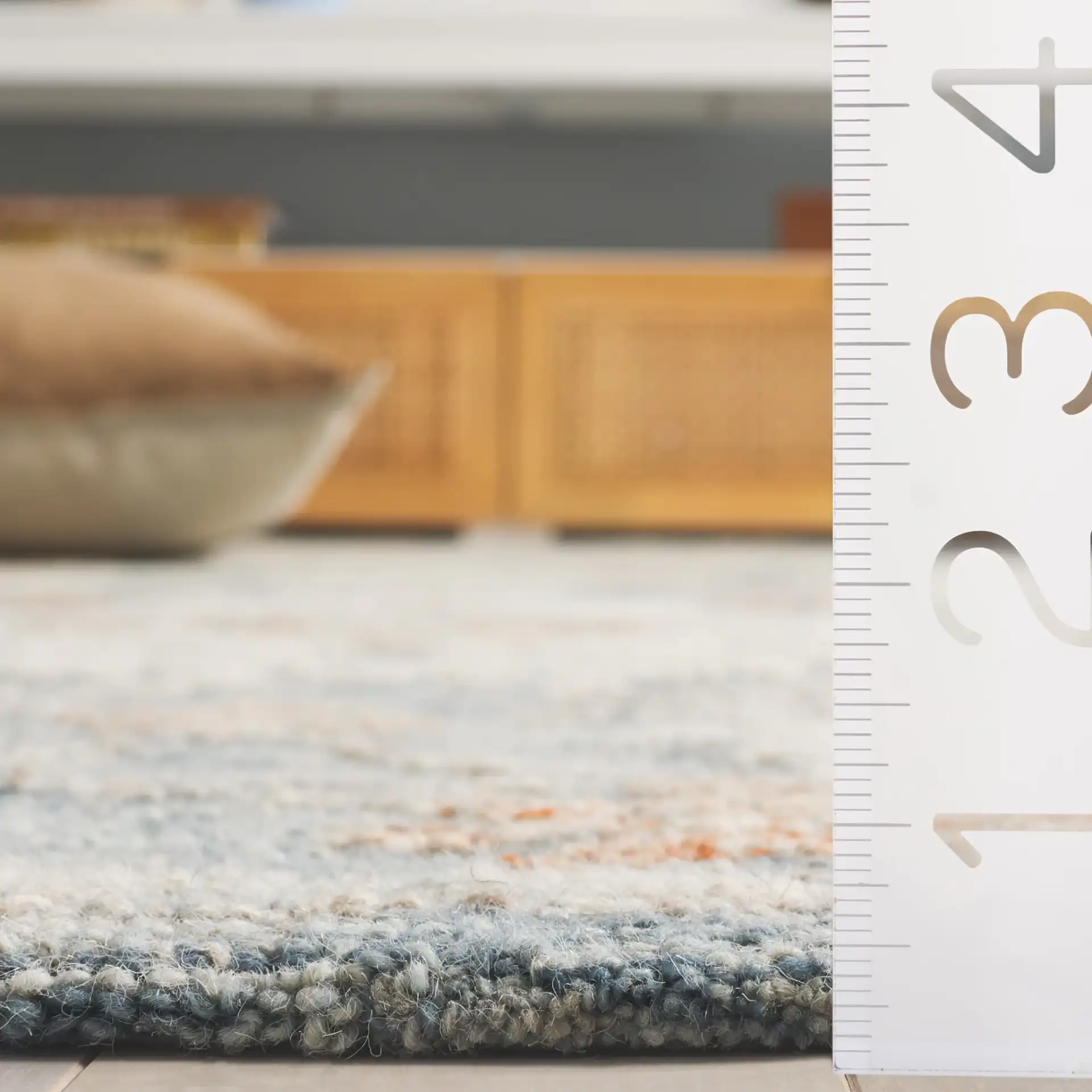 Marquee Oversized Floral Hand-Tufted Wool Rug in Blue / Rust in a styled room