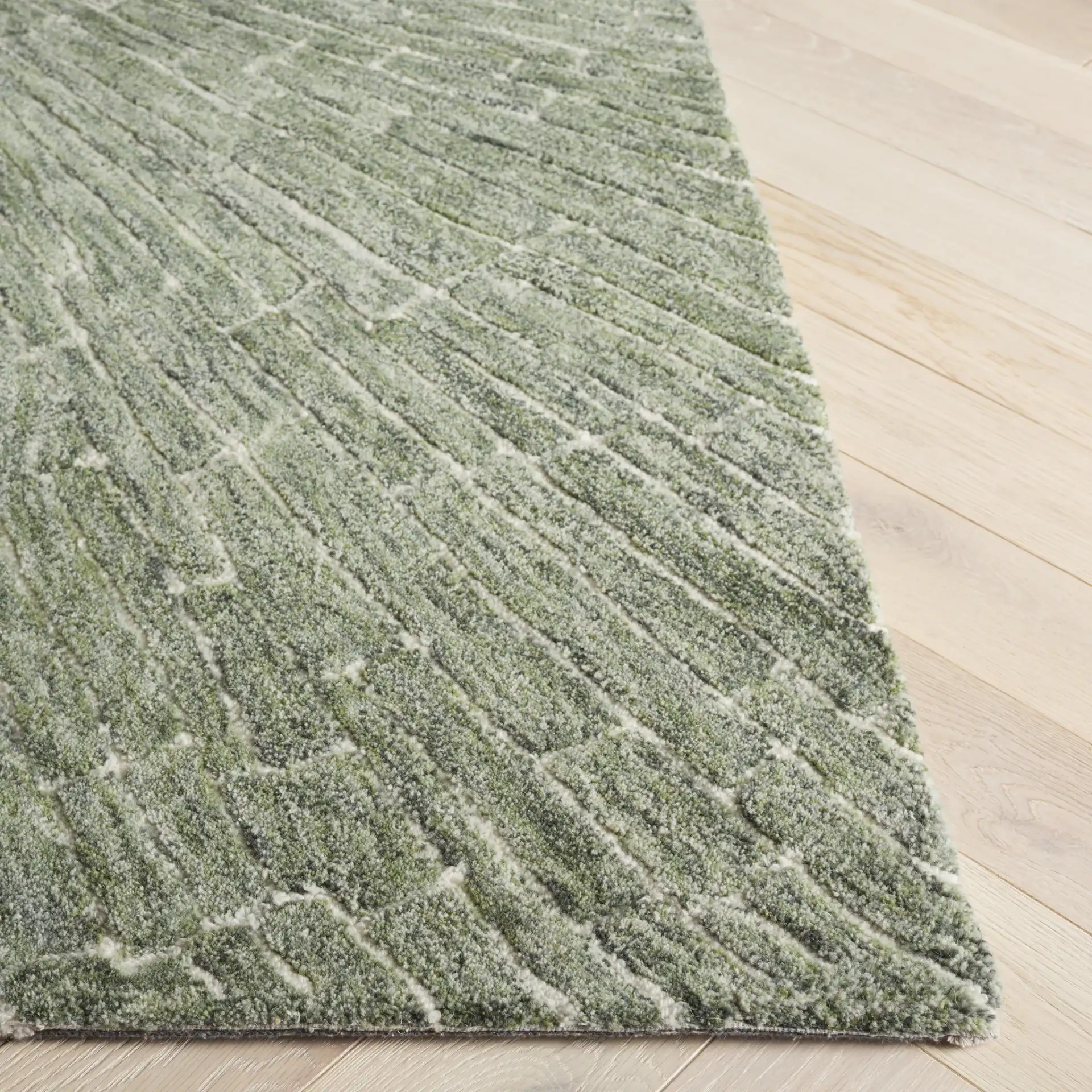 Marquee Mosaic Hand-Tufted Wool Rug in Green in a styled room