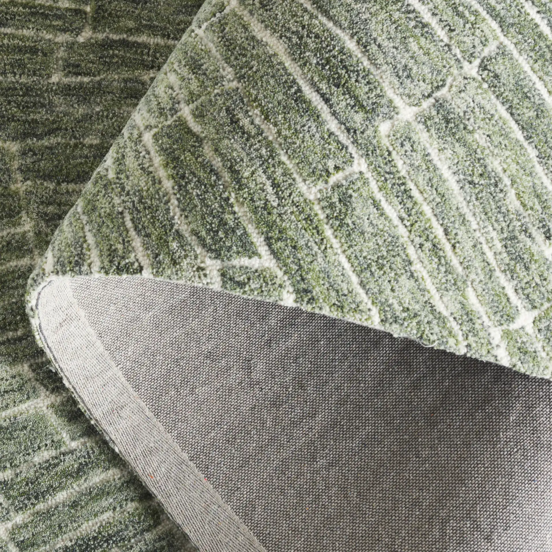 Marquee Mosaic Hand-Tufted Wool Rug in Green in a styled room