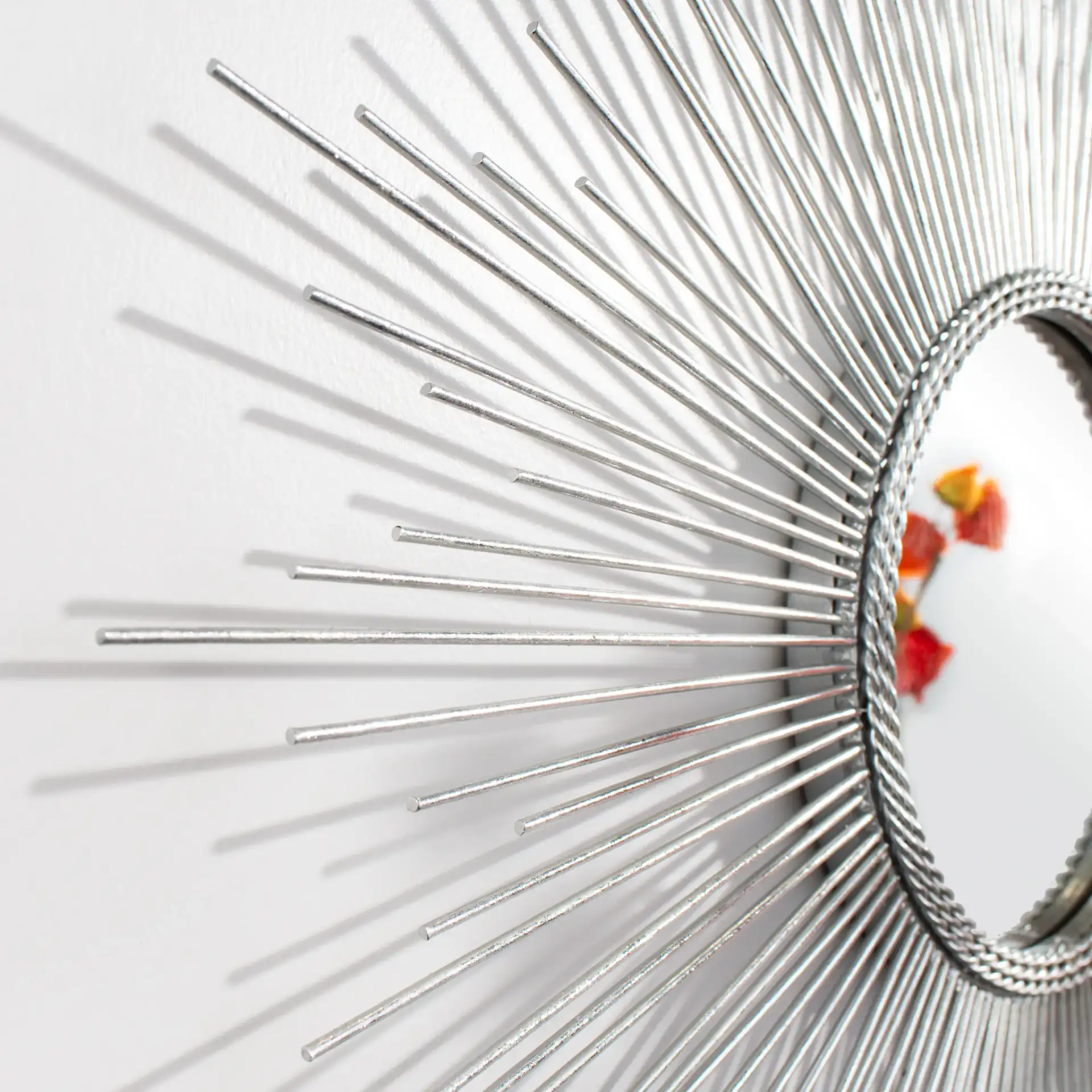 Emme Sunburst Mirror in Silver in a styled room