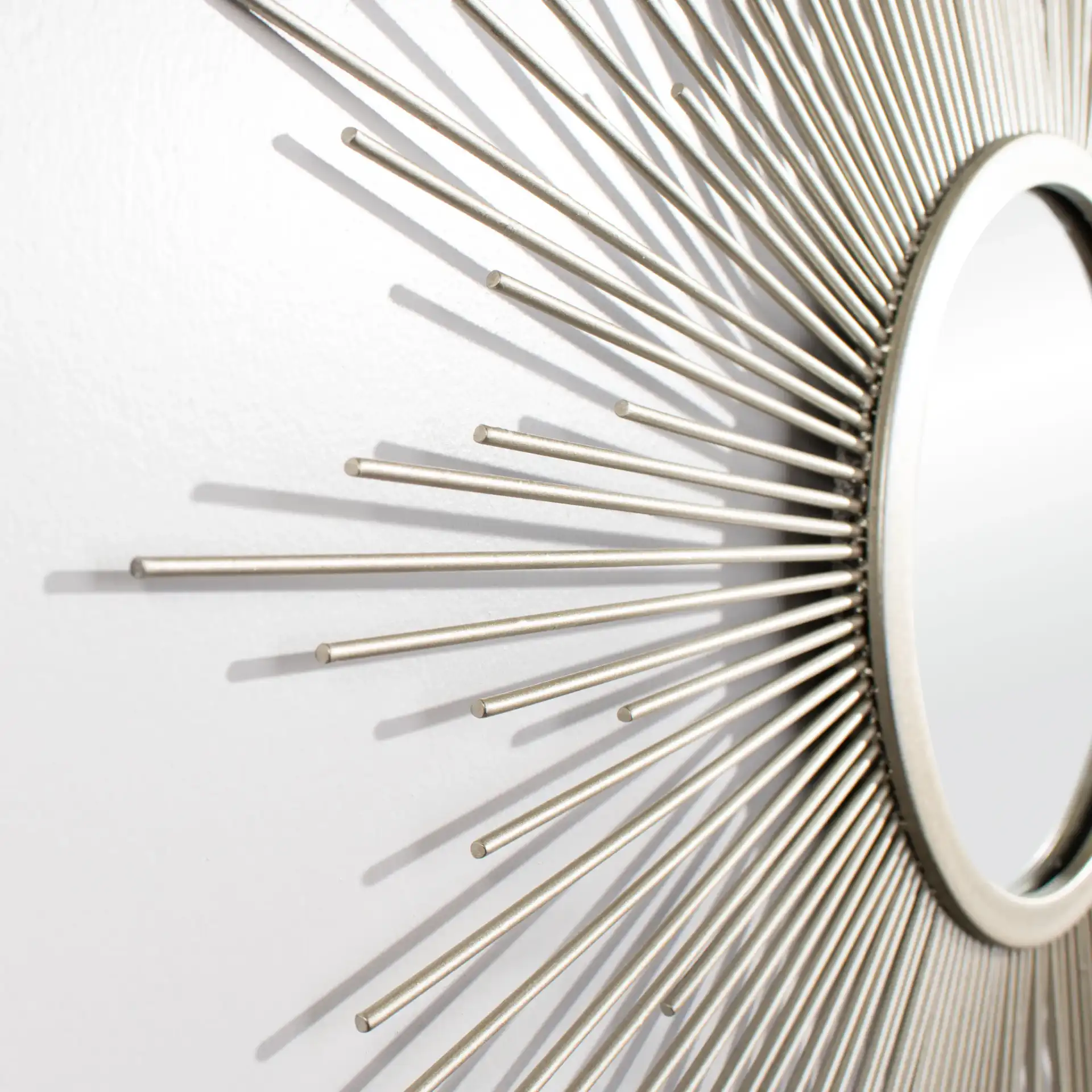 Alves Sunburst Mirror in Silver in a styled room