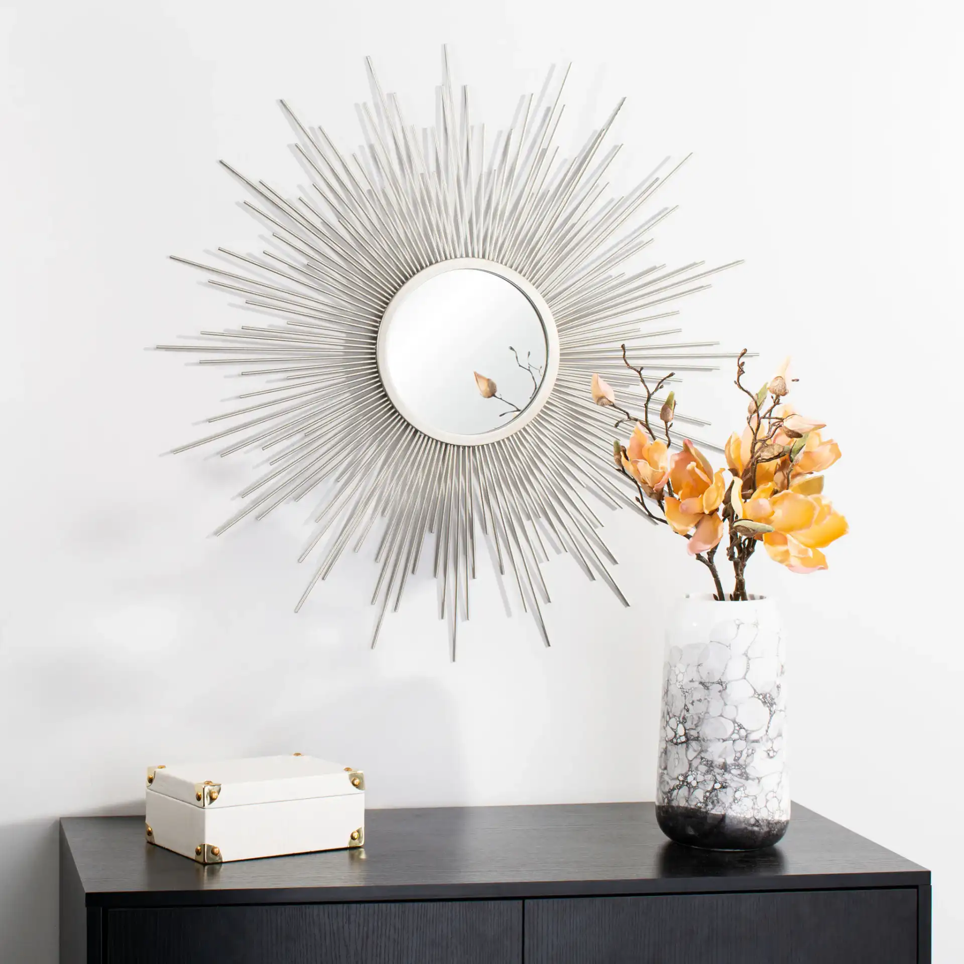 Alves Sunburst Mirror in Silver in a styled room