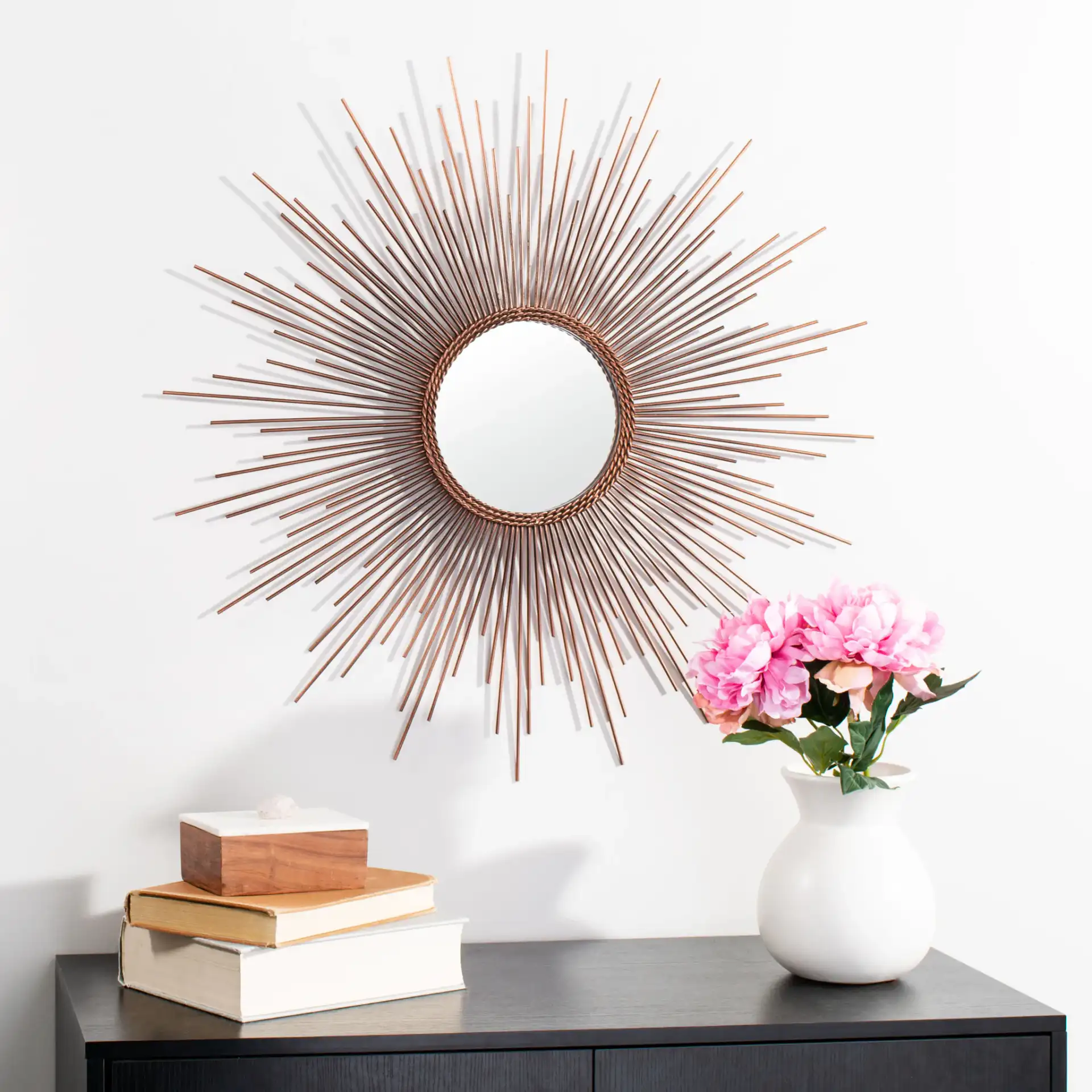 Genevieve Sunburst Mirror in Copper in a styled room
