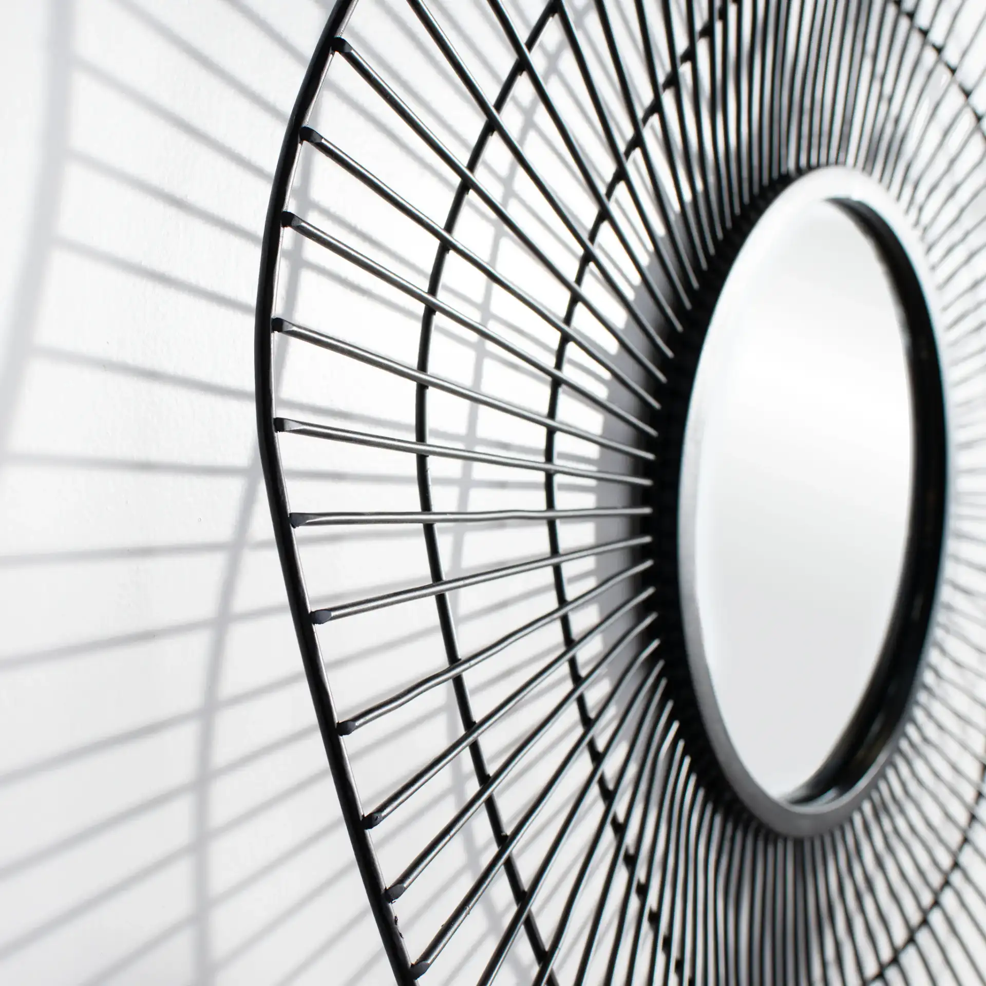 Rainey Mirror in Black in a styled room