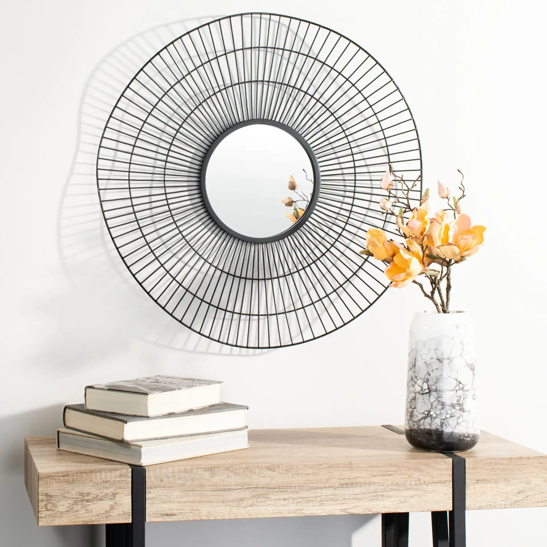 Rainey Mirror in Black in a styled room