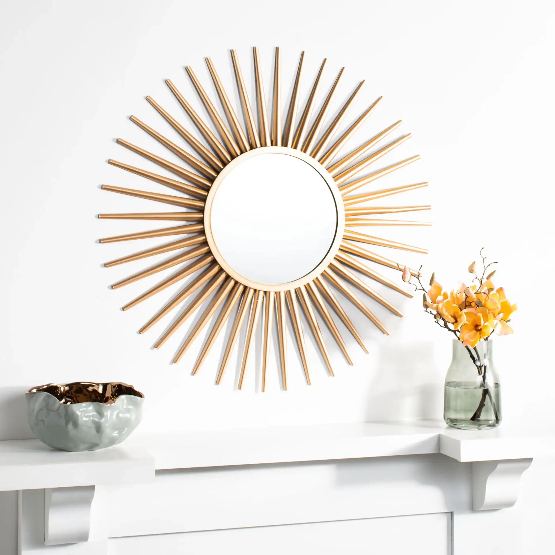 Zyla Sunburst Mirror in Gold in a styled room