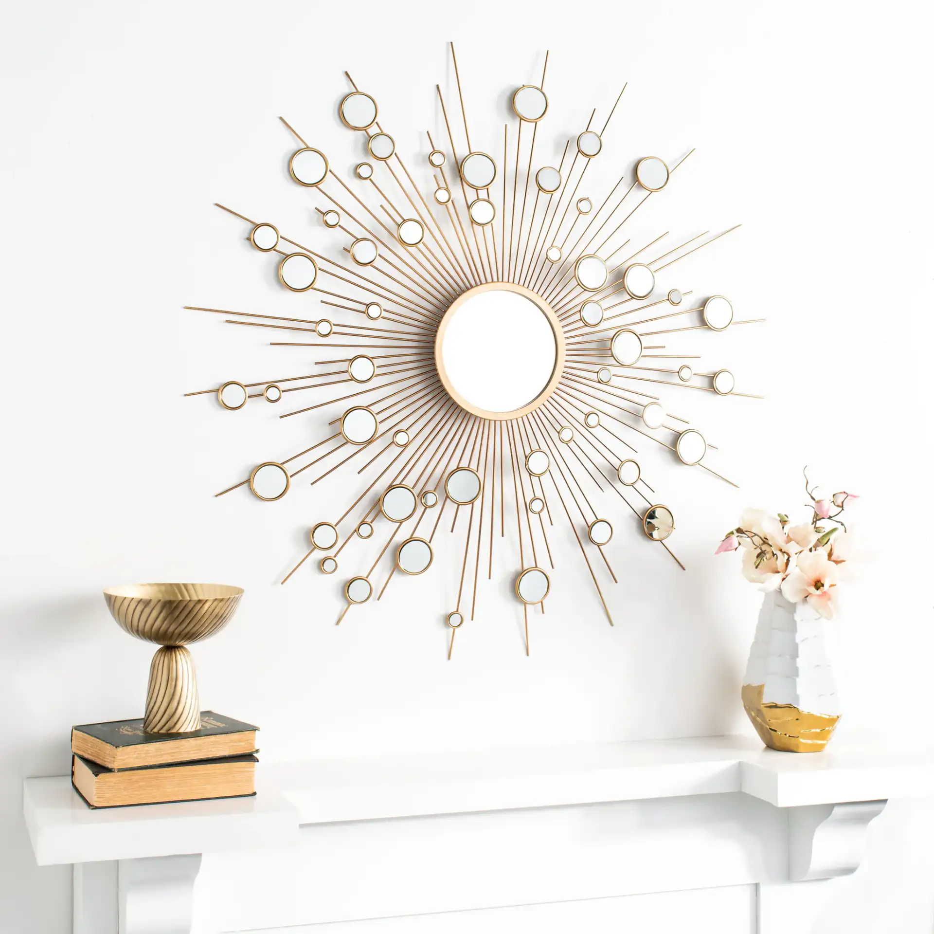 Ariah Sunburst Mirror in Gold in a styled room