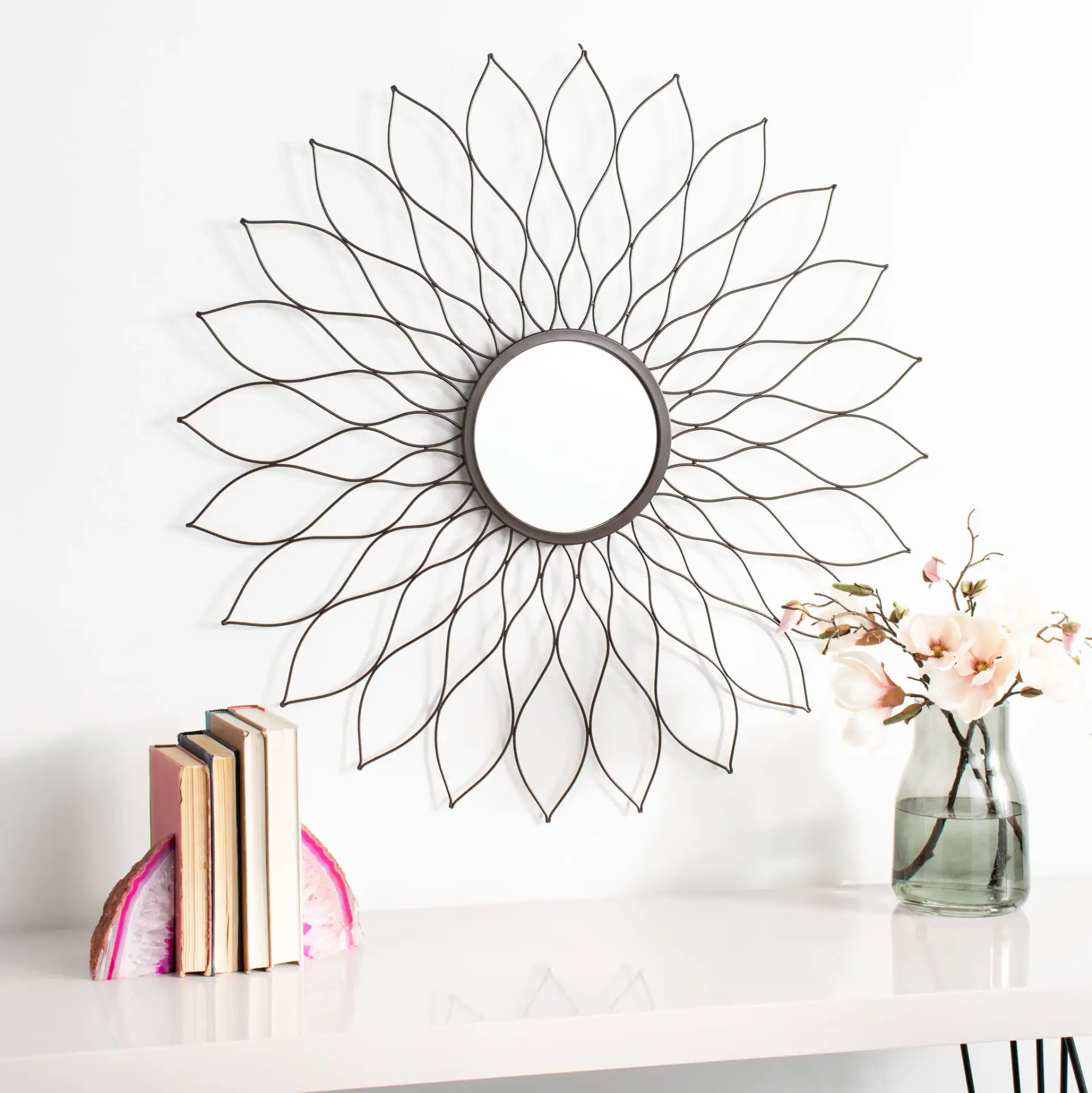 Ravin Sunburst Mirror in Champagne in a styled room