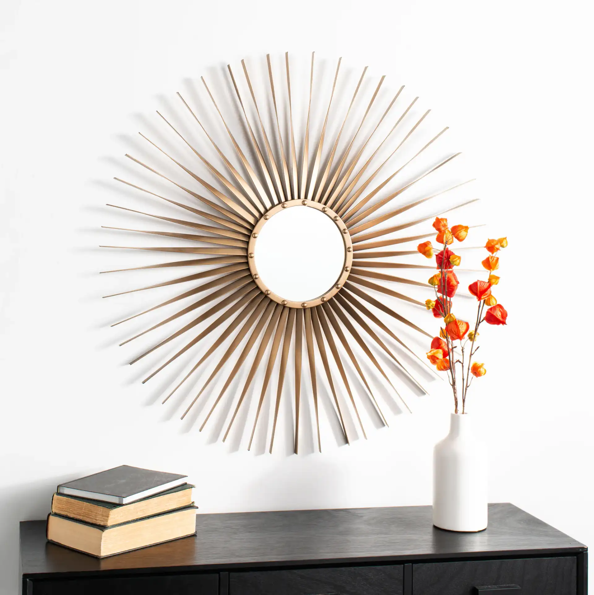 Lachlyn Sunburst Mirror in Gold in a styled room