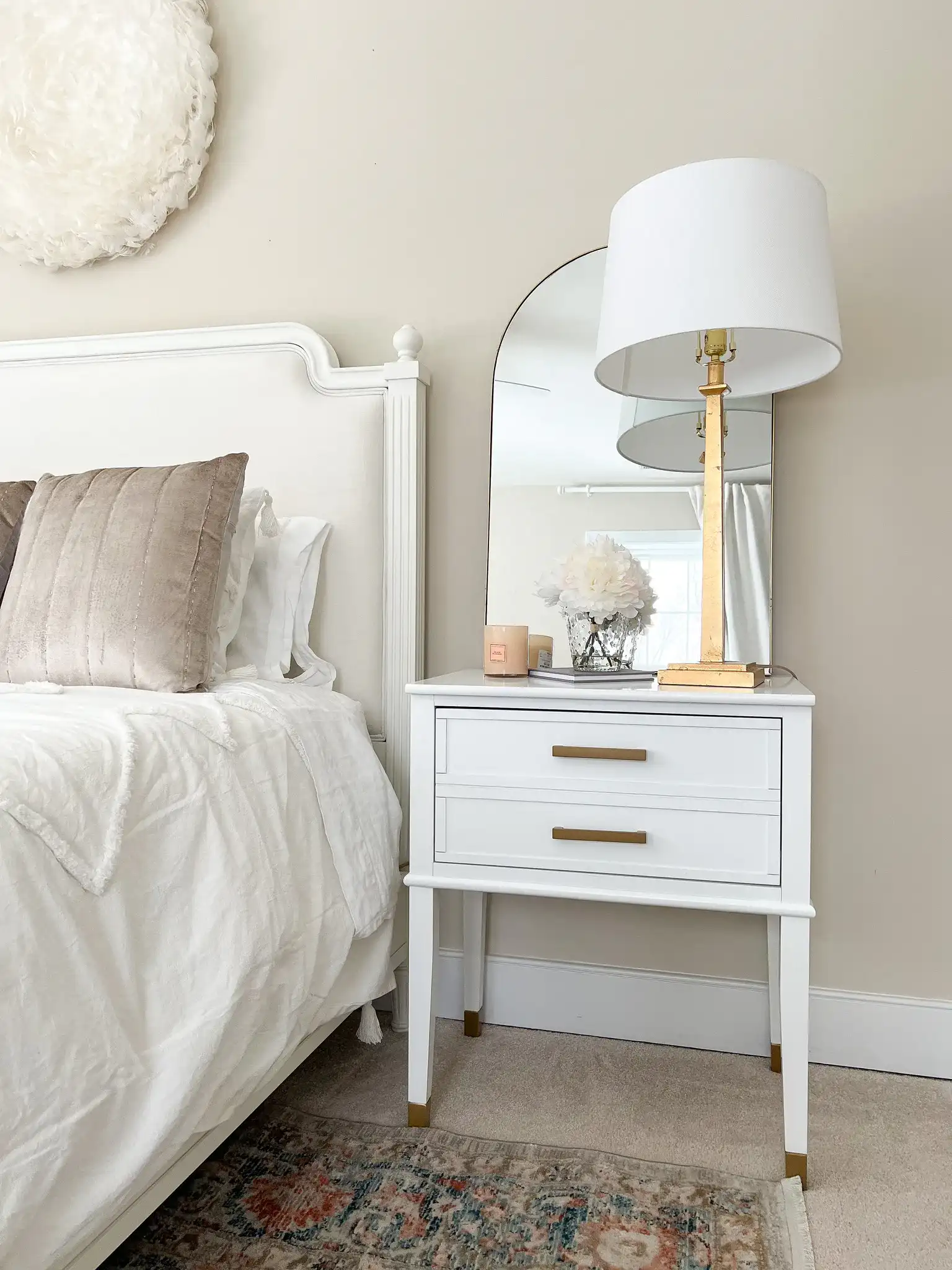 Jinla 20.25-Inch Mirror in Gold in a styled room