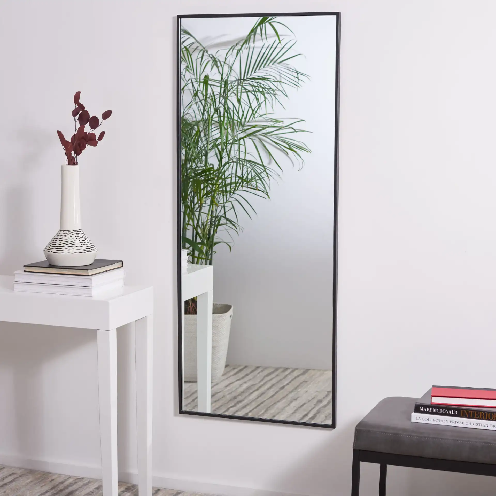 Cala 24-Inch Mirror in Black in a styled room