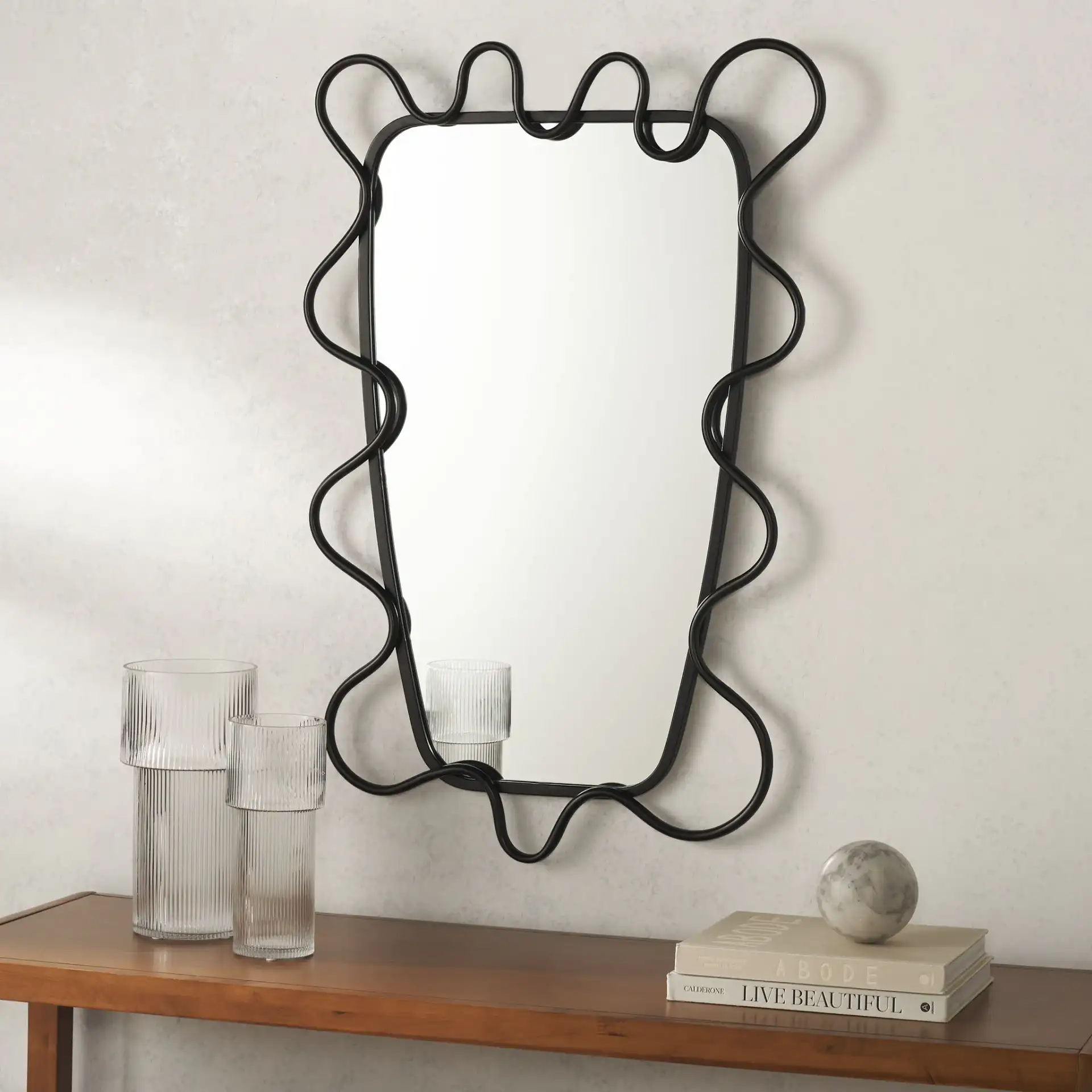 Nova 24" Mirror in Black in a styled room