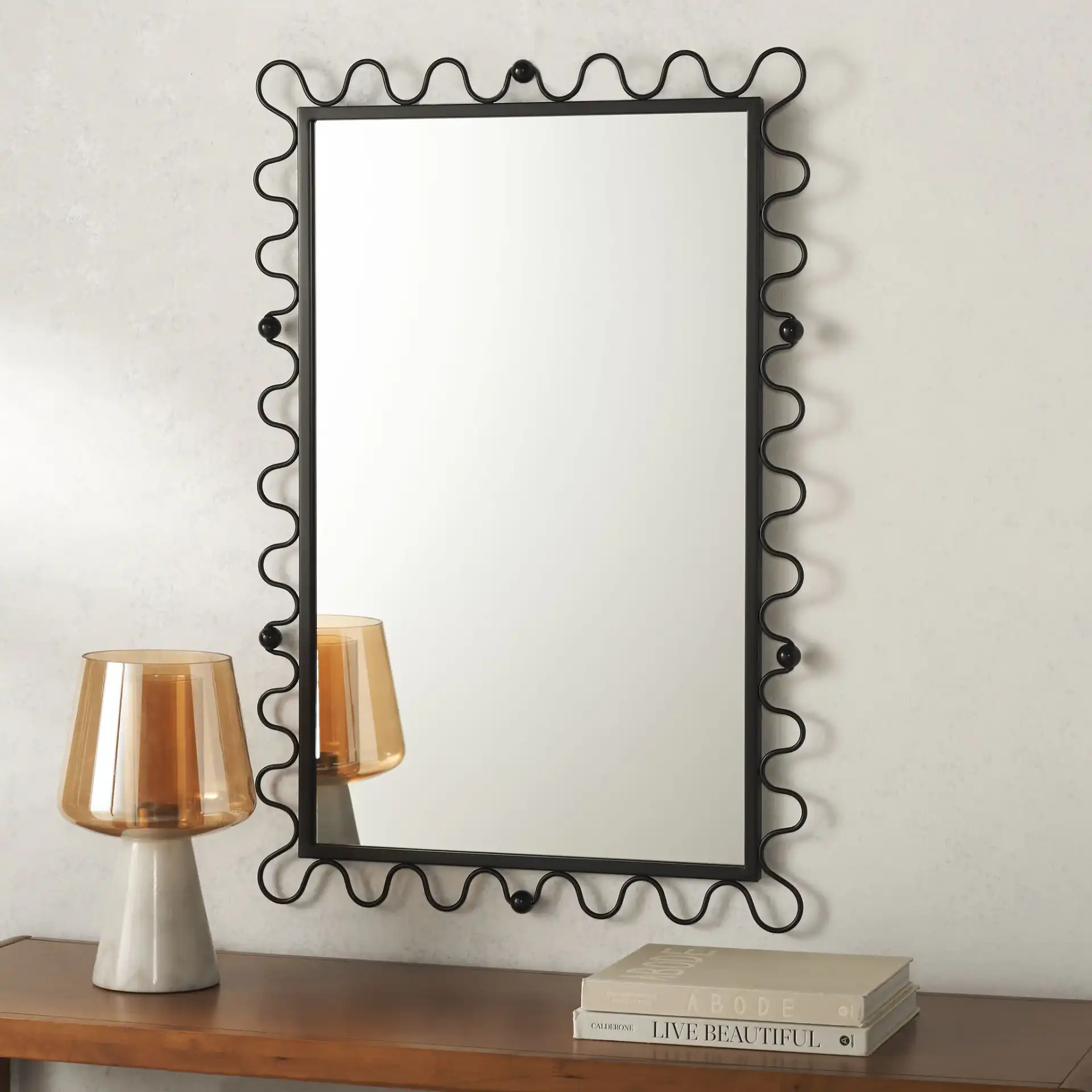 Cinq 24-Inch Mirror in Black in a styled room