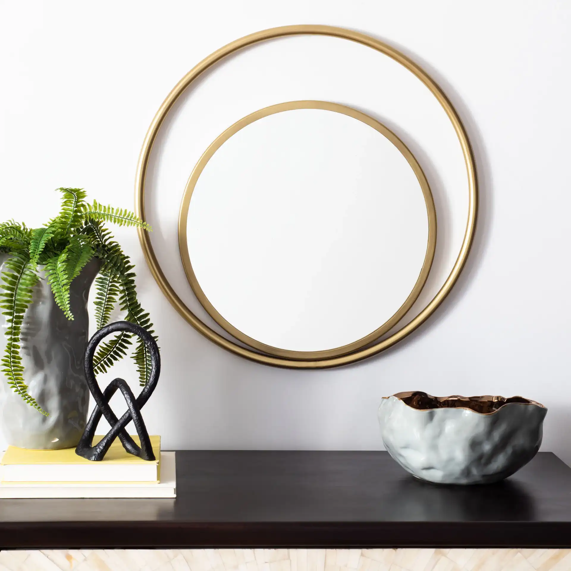 Wonder Mirror in Brushed Brass in a styled room