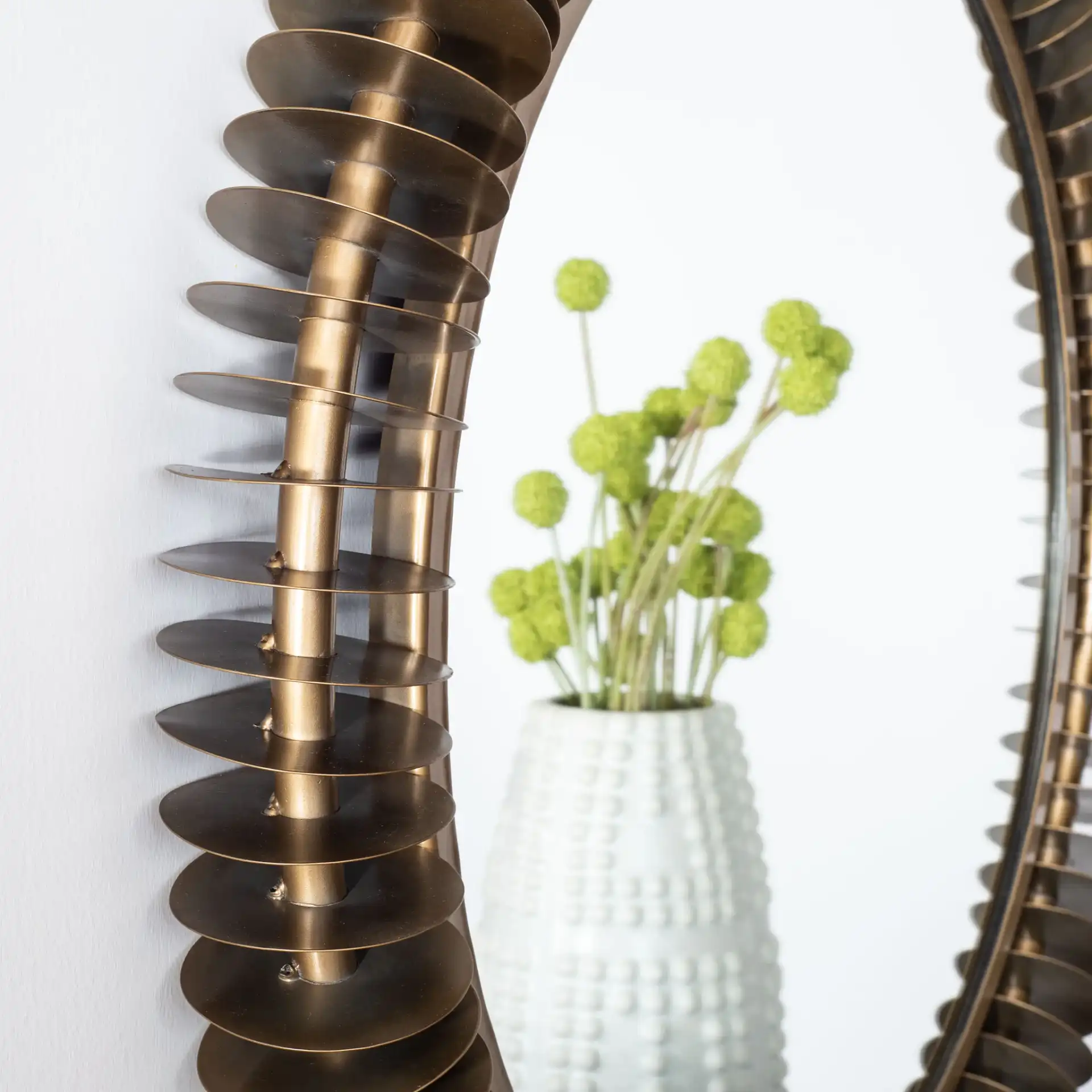 Storm Mirror in Brass Antique in a styled room