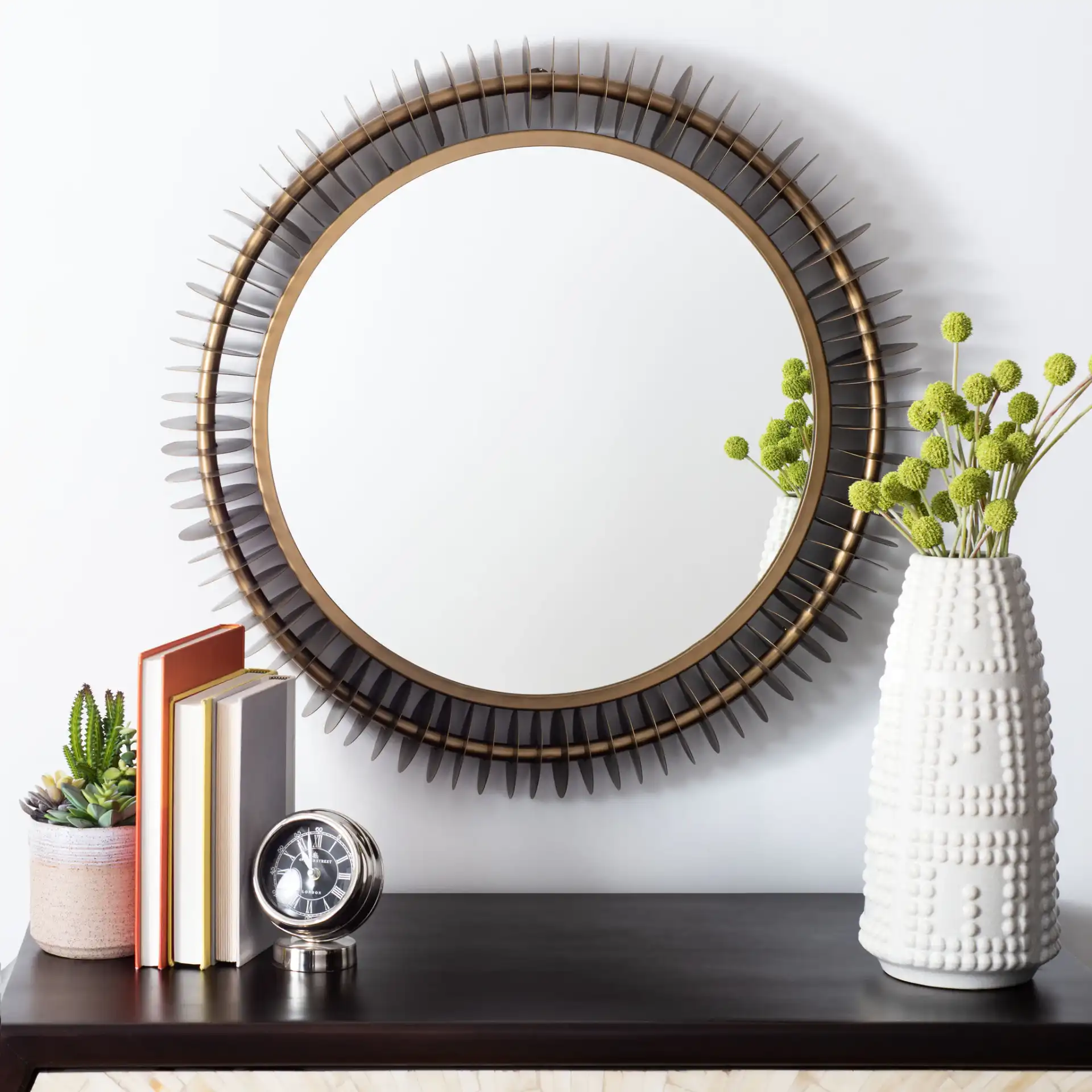 Storm Mirror in Brass Antique in a styled room