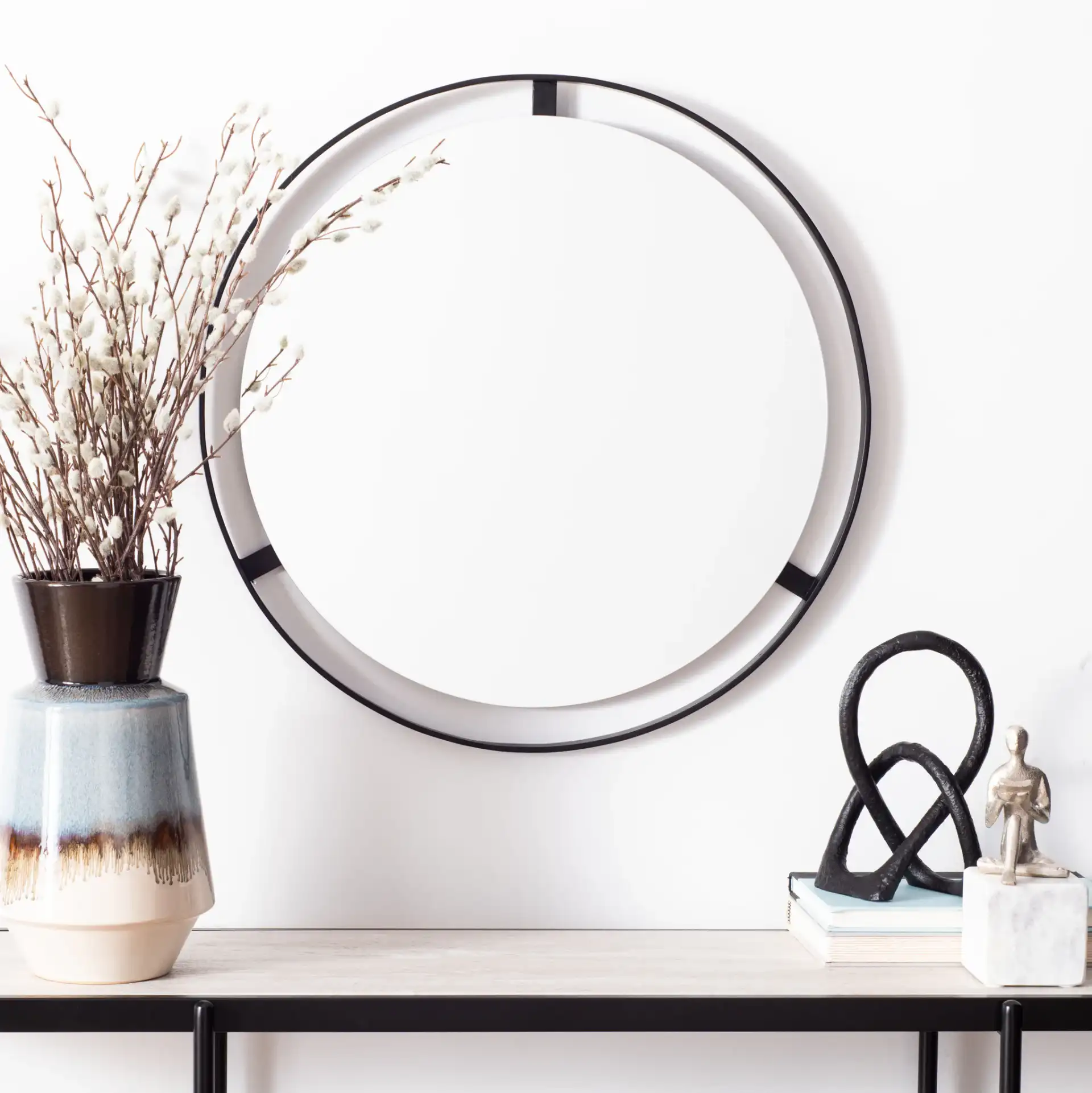 Radlin Mirror in Matte Black in a styled room