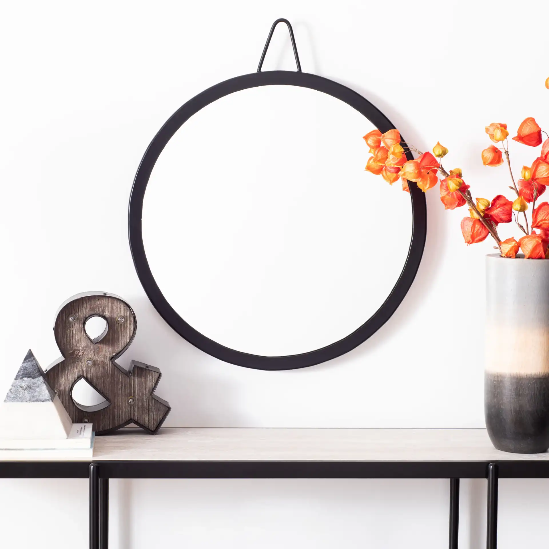 Darsey Mirror in Matte Black in a styled room