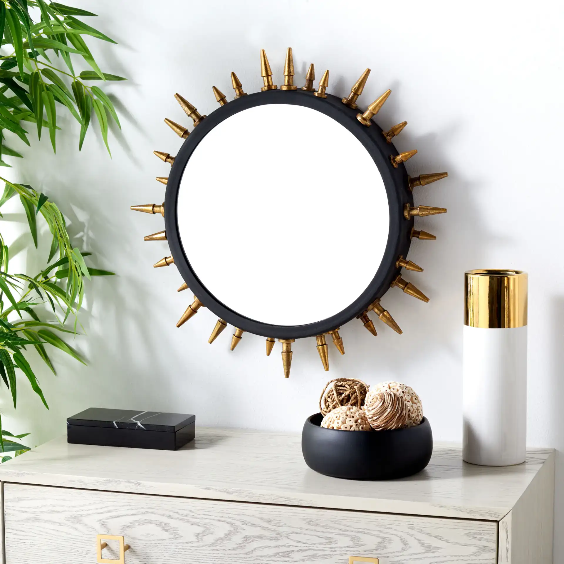 Ceinth 20" Mirror in Black / Gold in a styled room