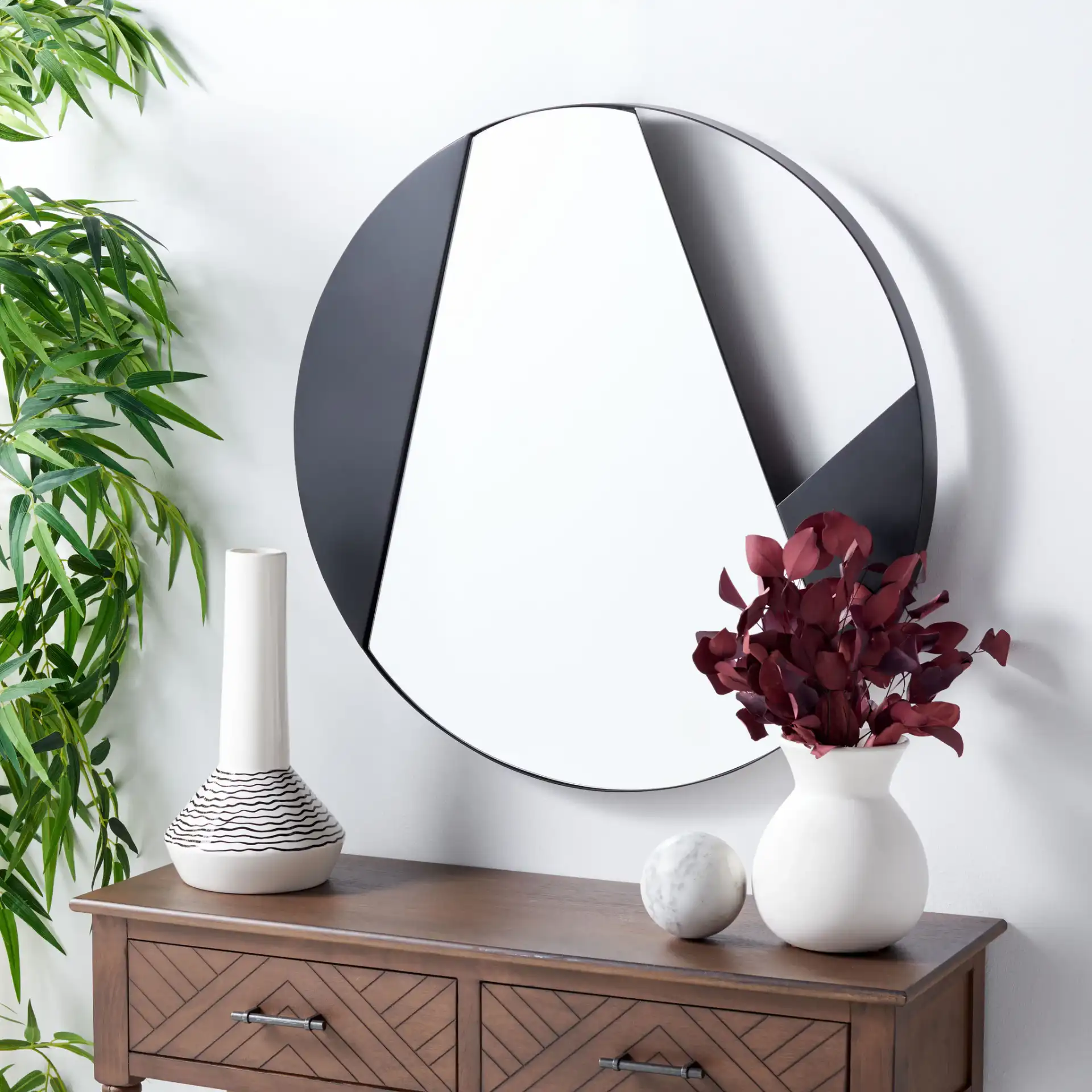 Dinas 28-Inch Mirror in Matte Black in a styled room