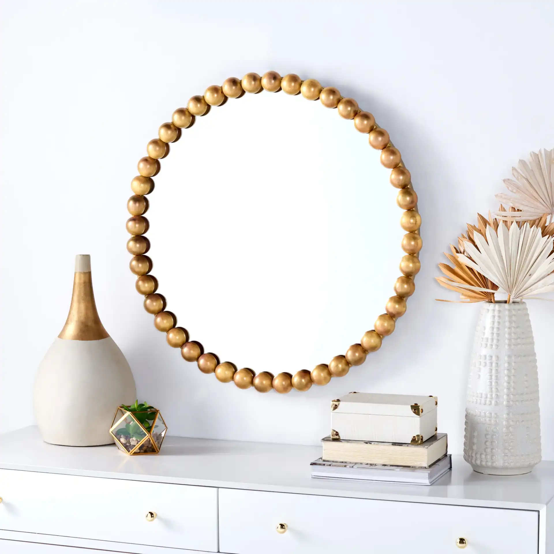 Pace Mirror in Burnt Brass in a styled room