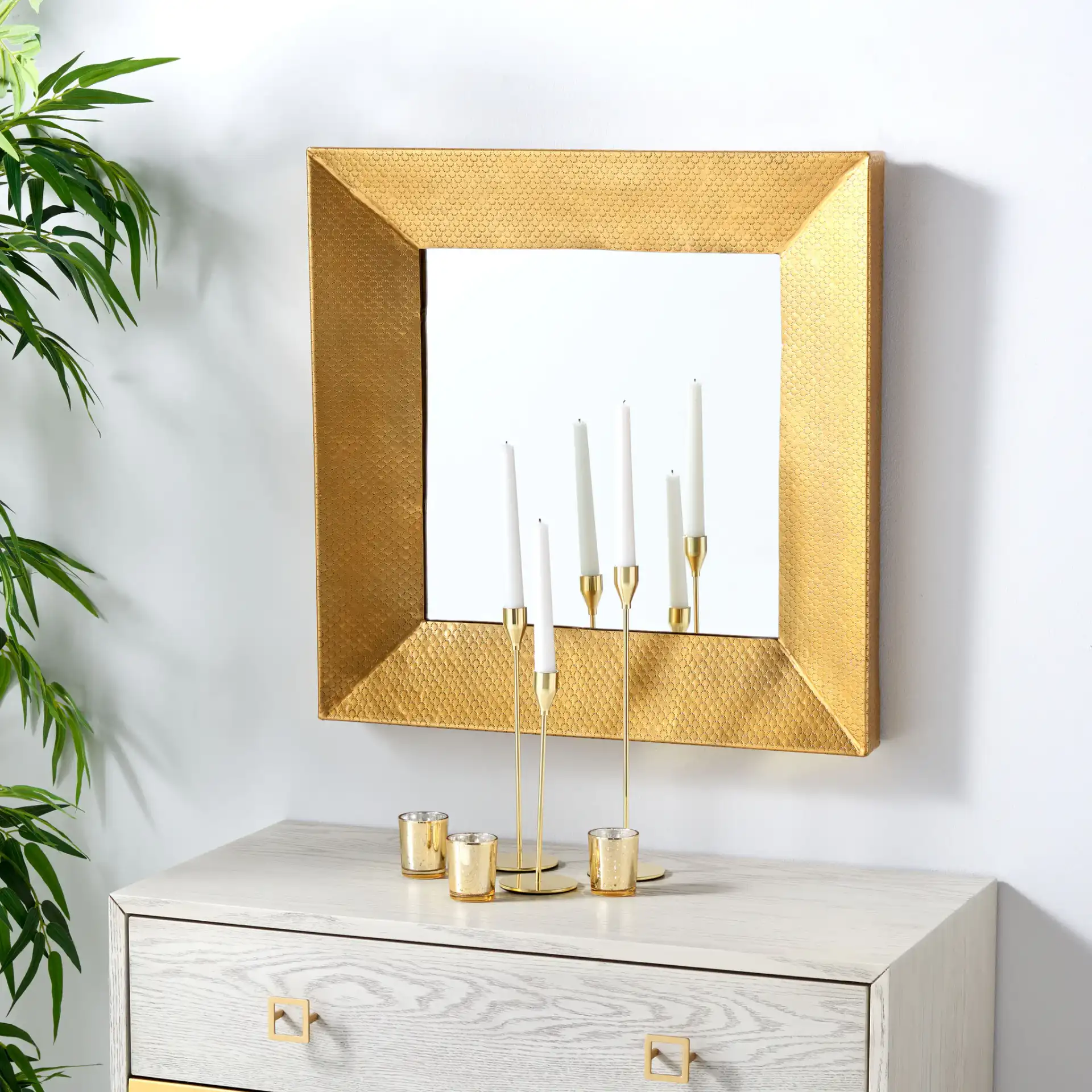 Pallava 24-Inch Mirror in Gold in a styled room