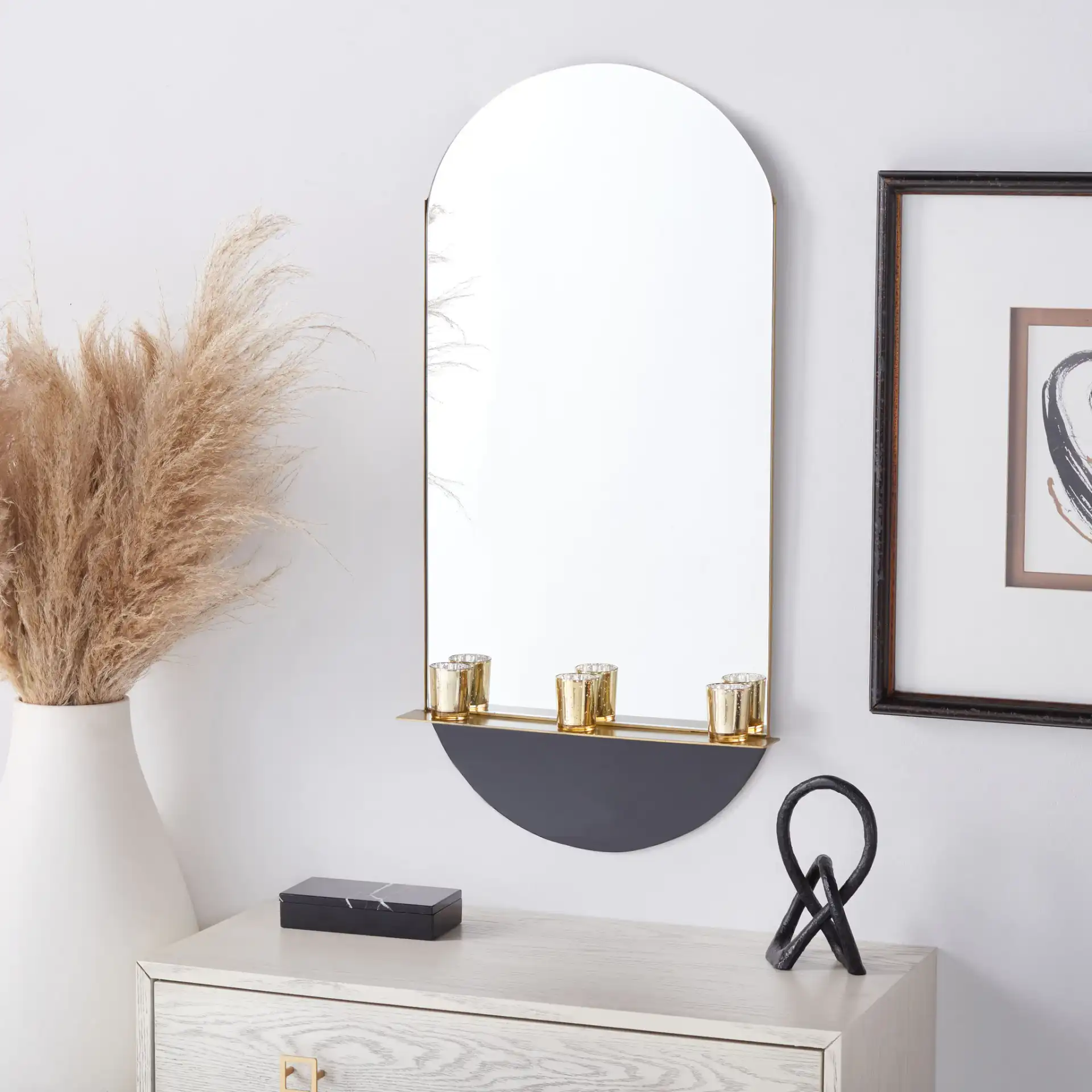 Norbury 18-Inch Mirror in Brass / Black in a styled room