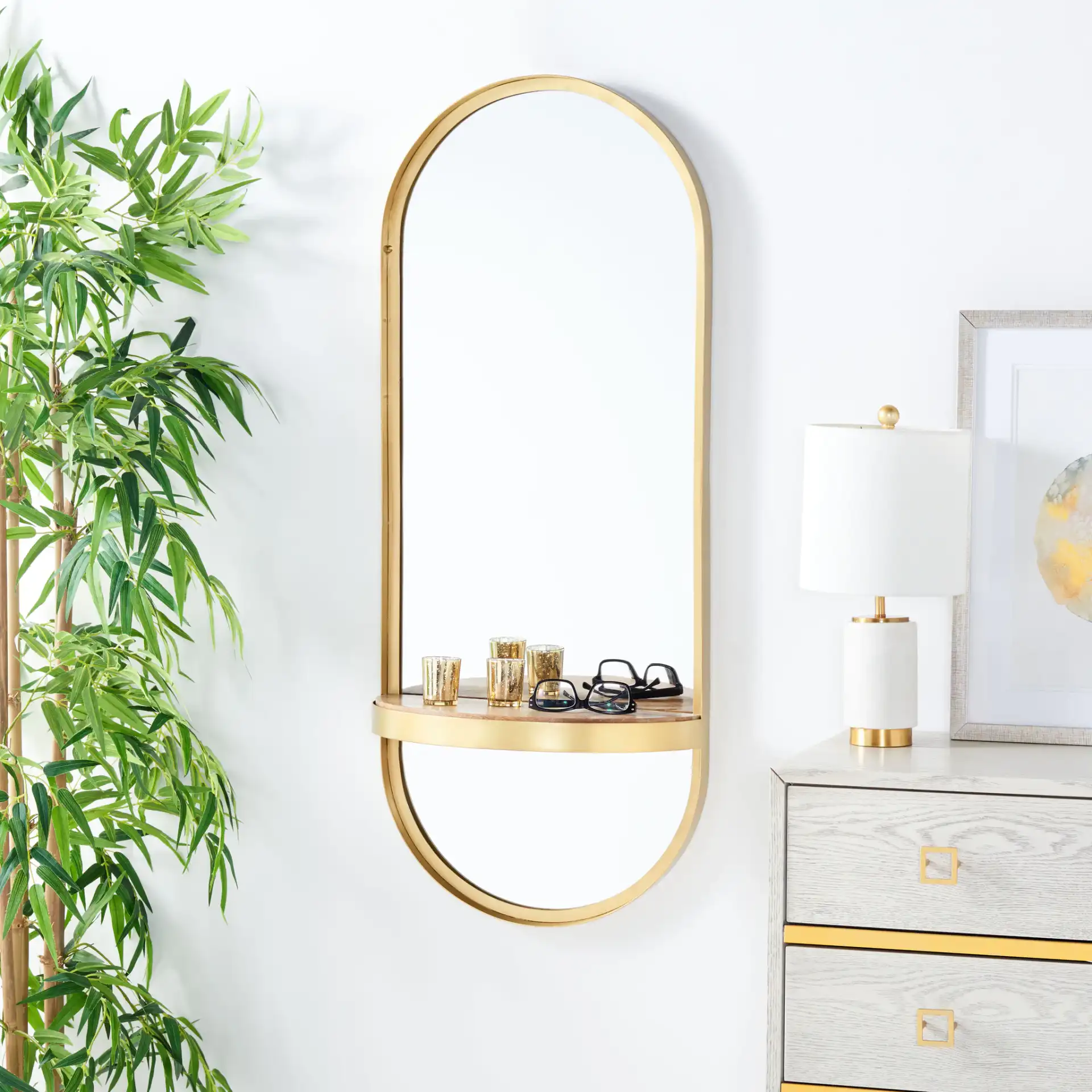 Laycie 18-Inch Mirror in Brushed Brass in a styled room