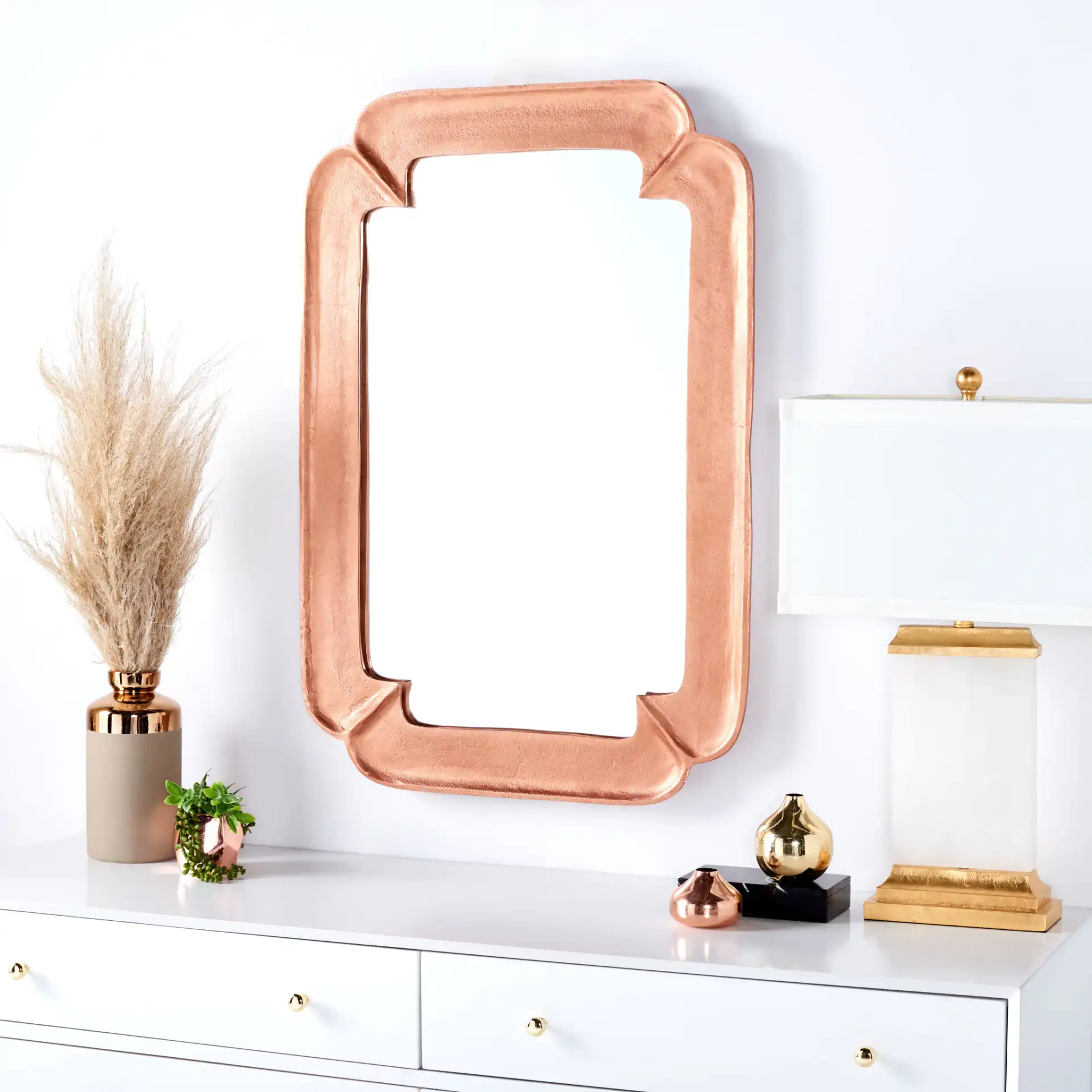 Osiris 24.5-Inch Mirror in Copper in a styled room
