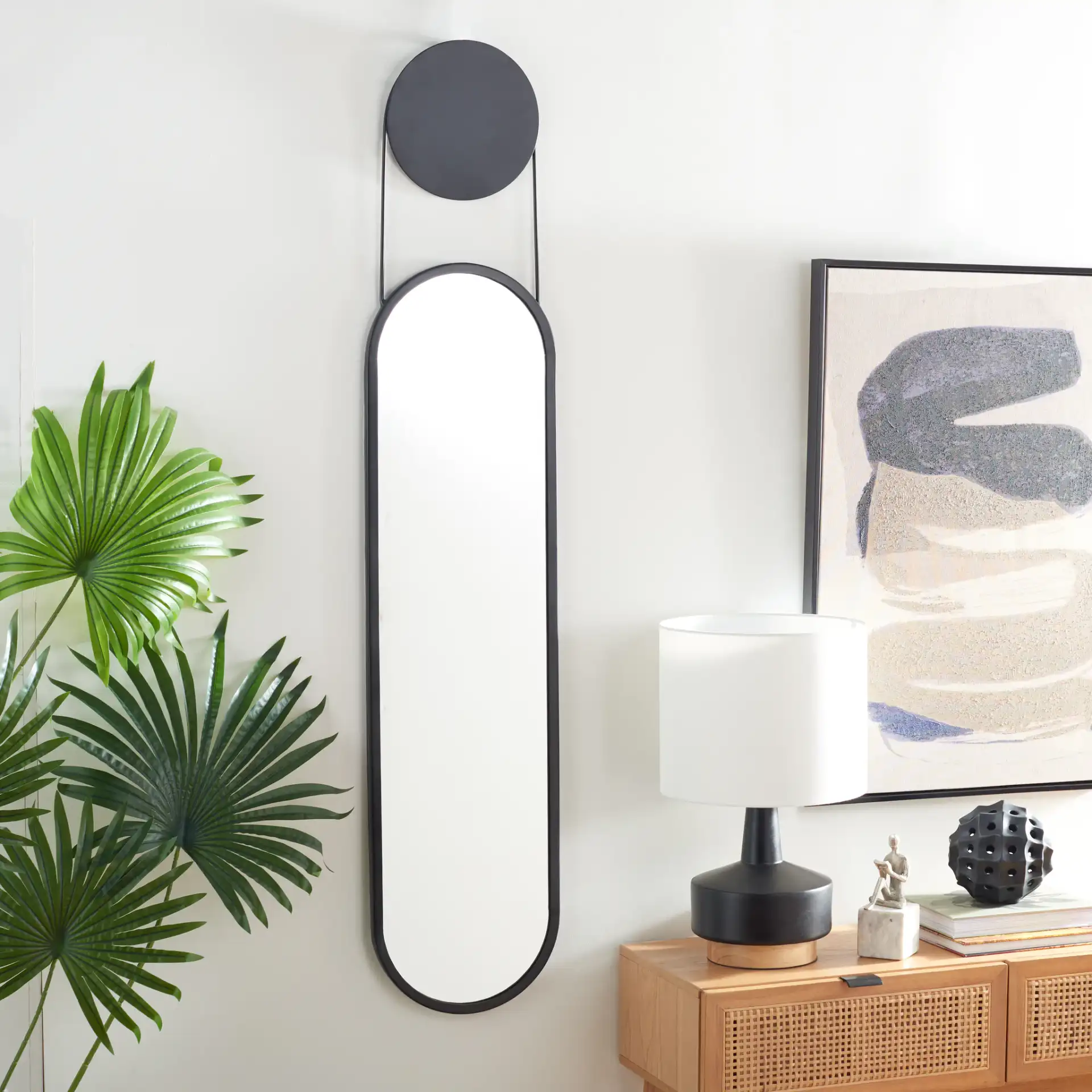 Aistina 12.5" Mirror in Matte Black in a styled room