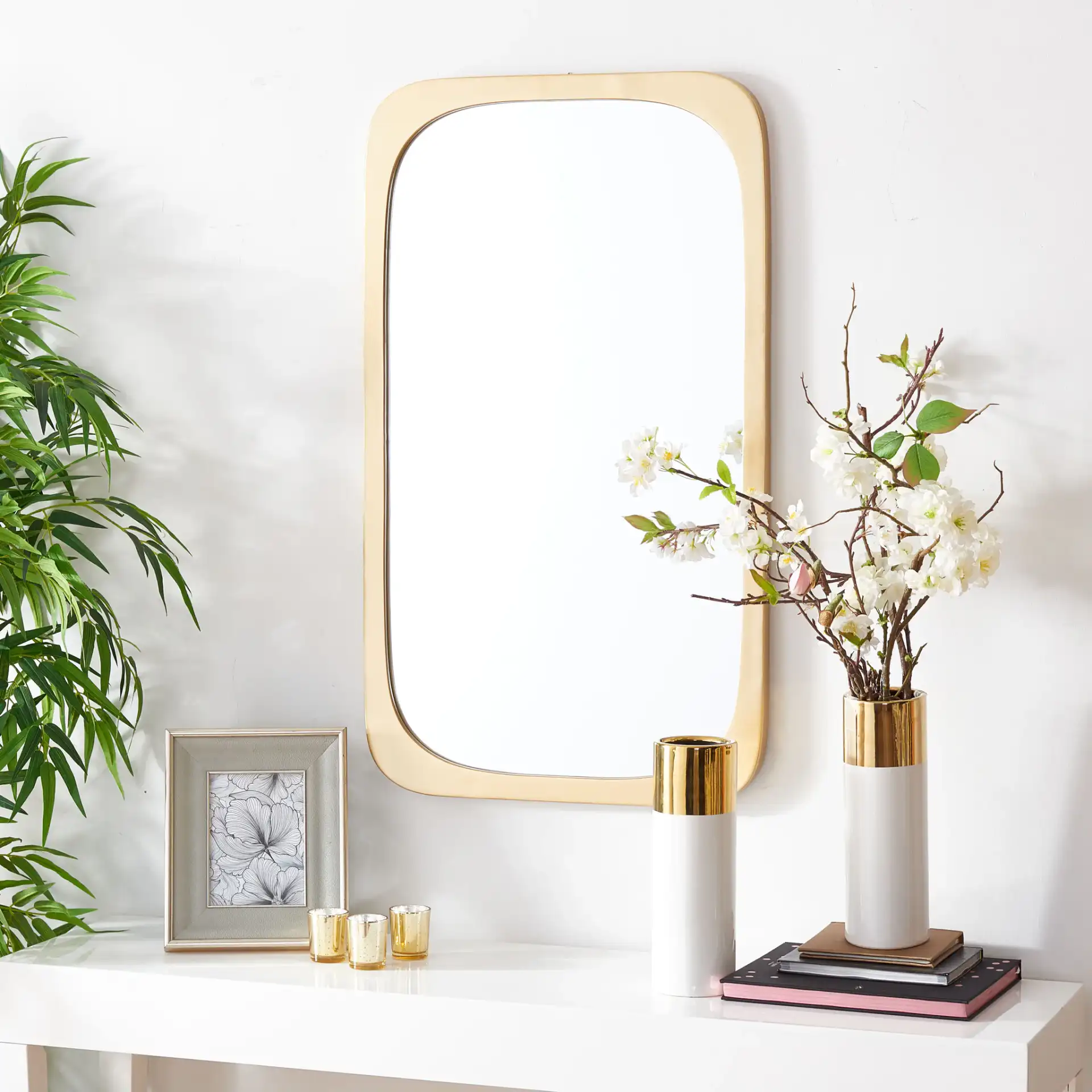 Bramwell Mirror in Gold in a styled room