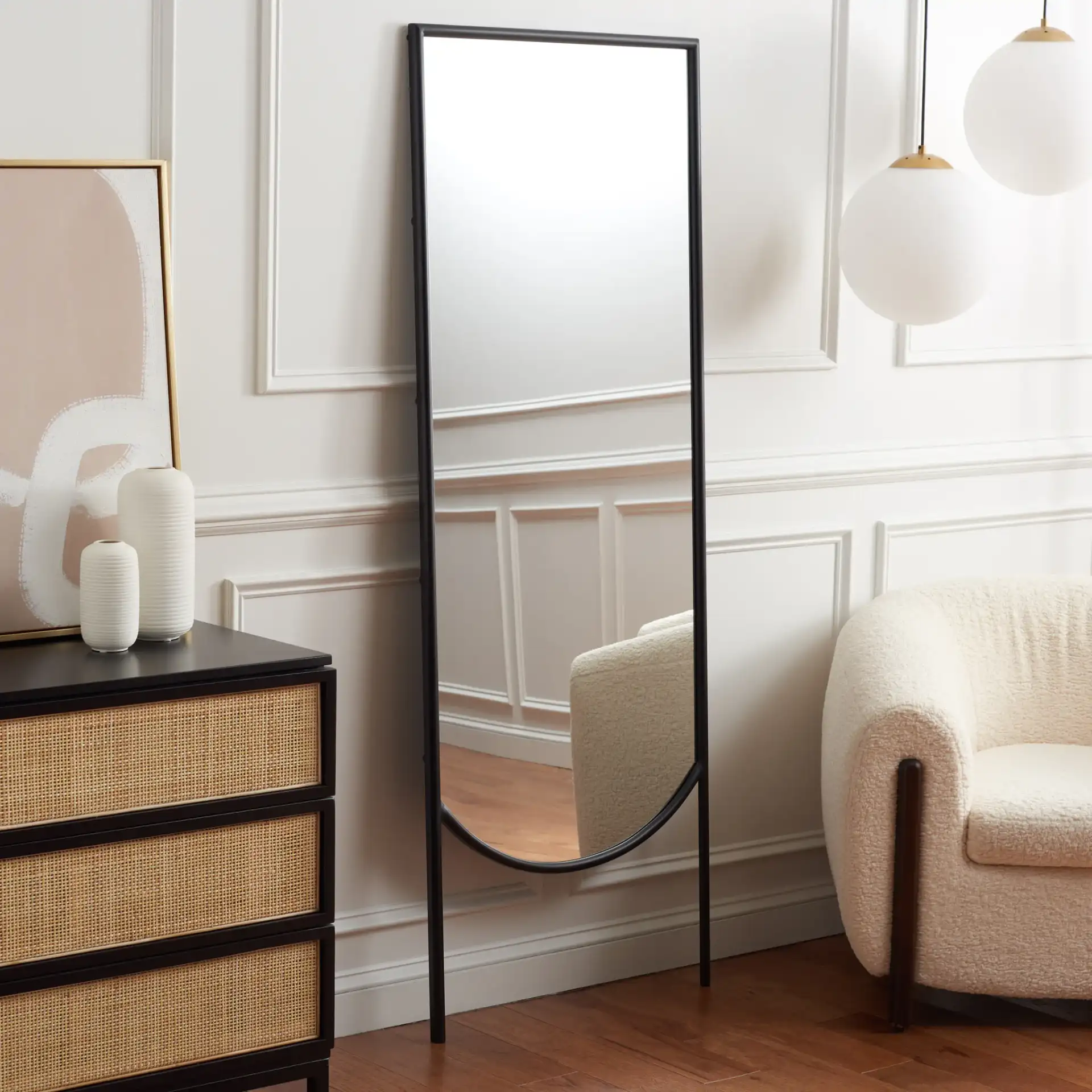 Patel 25-Inch Mirror in Black in a styled room