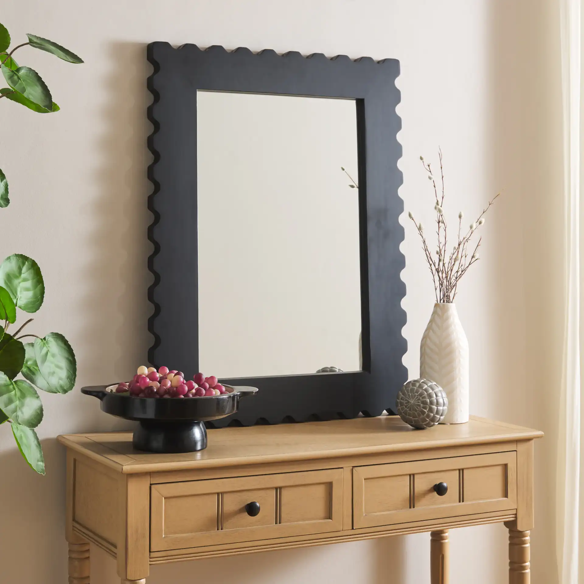 Nadia 24" Mirror in Black in a styled room