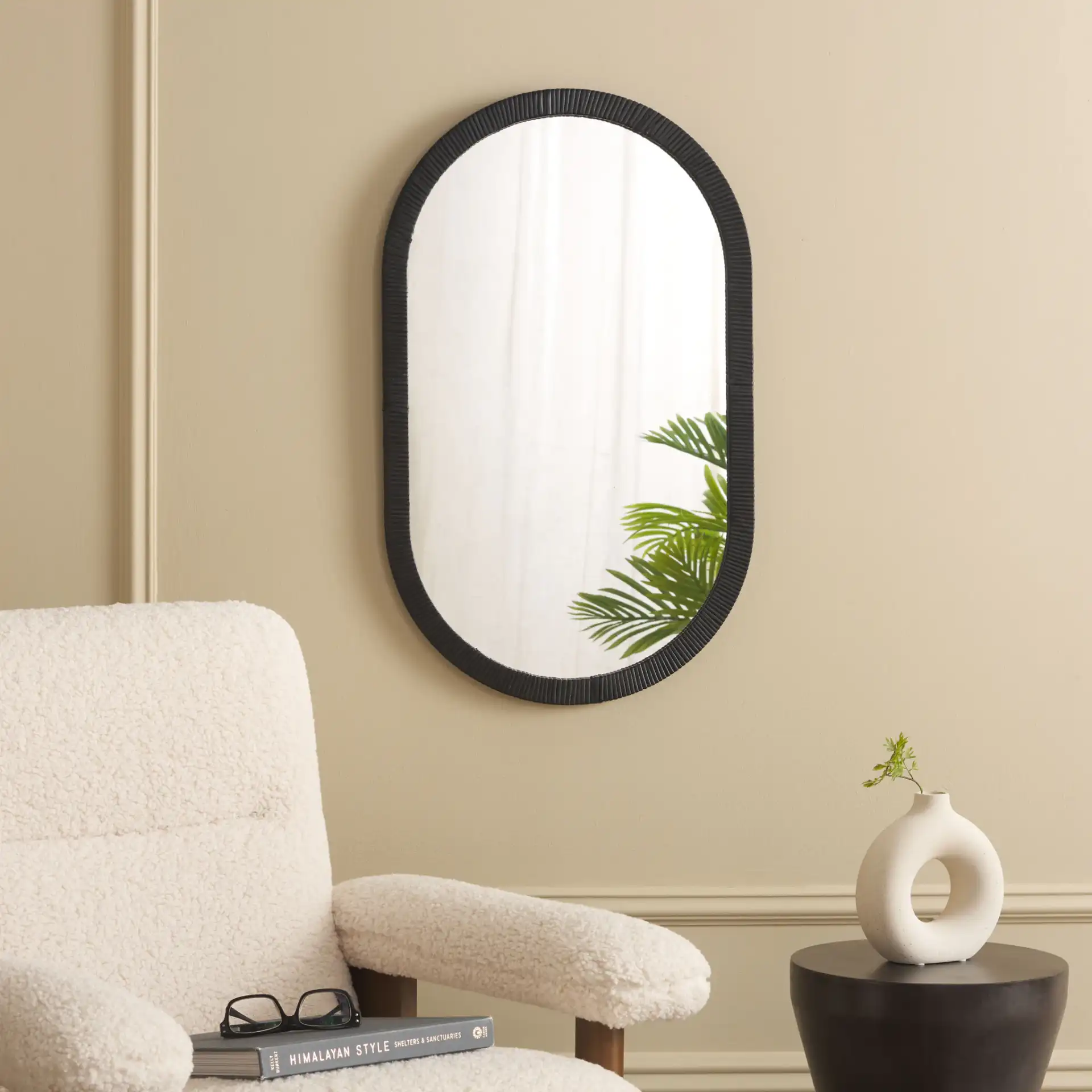 Minna 17.72-Inch Mirror in Black in a styled room