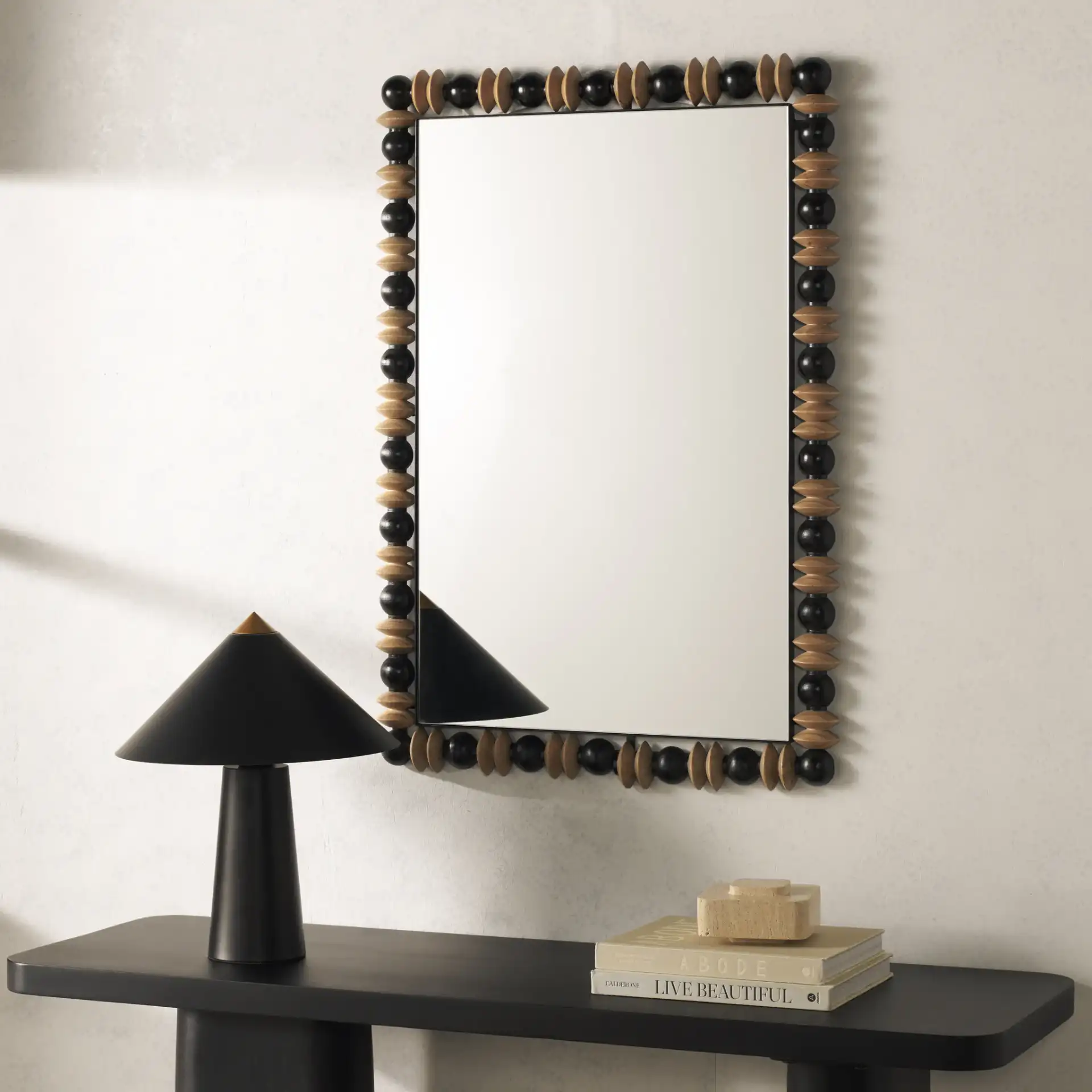 Azaria 24.6-Inch Mirror in Black / Natural in a styled room