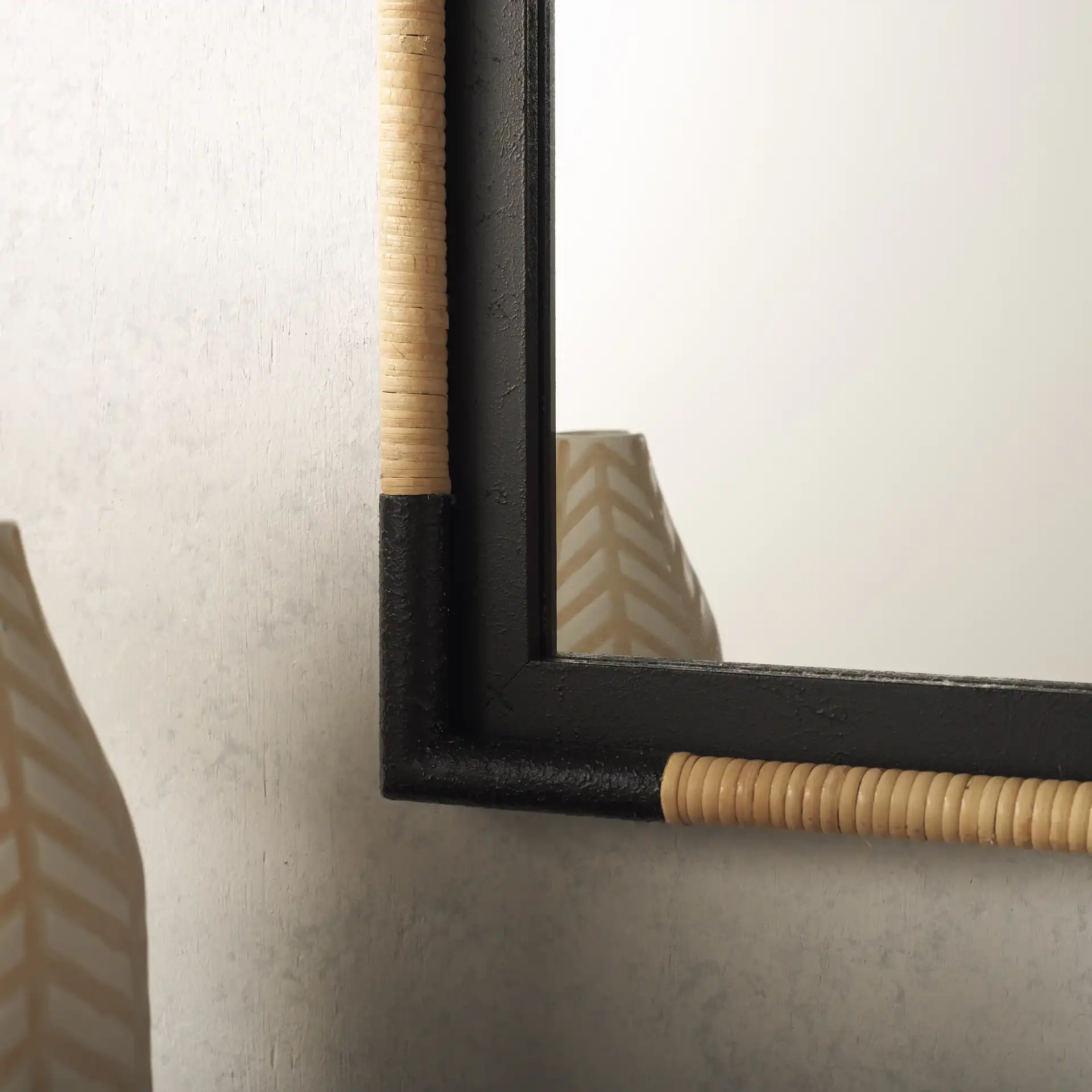 Renah 23.6-Inch Mirror in Natural / Black in a styled room