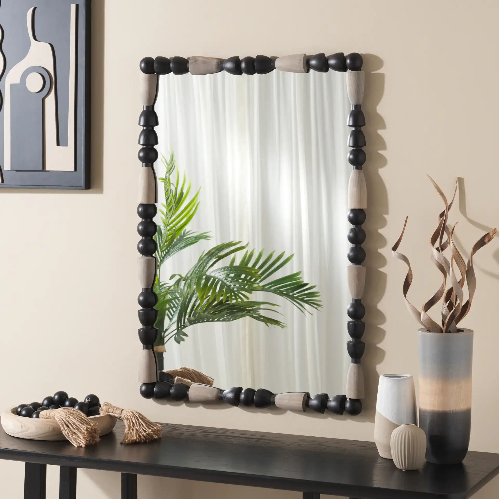 Gabbhi Mirror in Black / Gray in a styled room