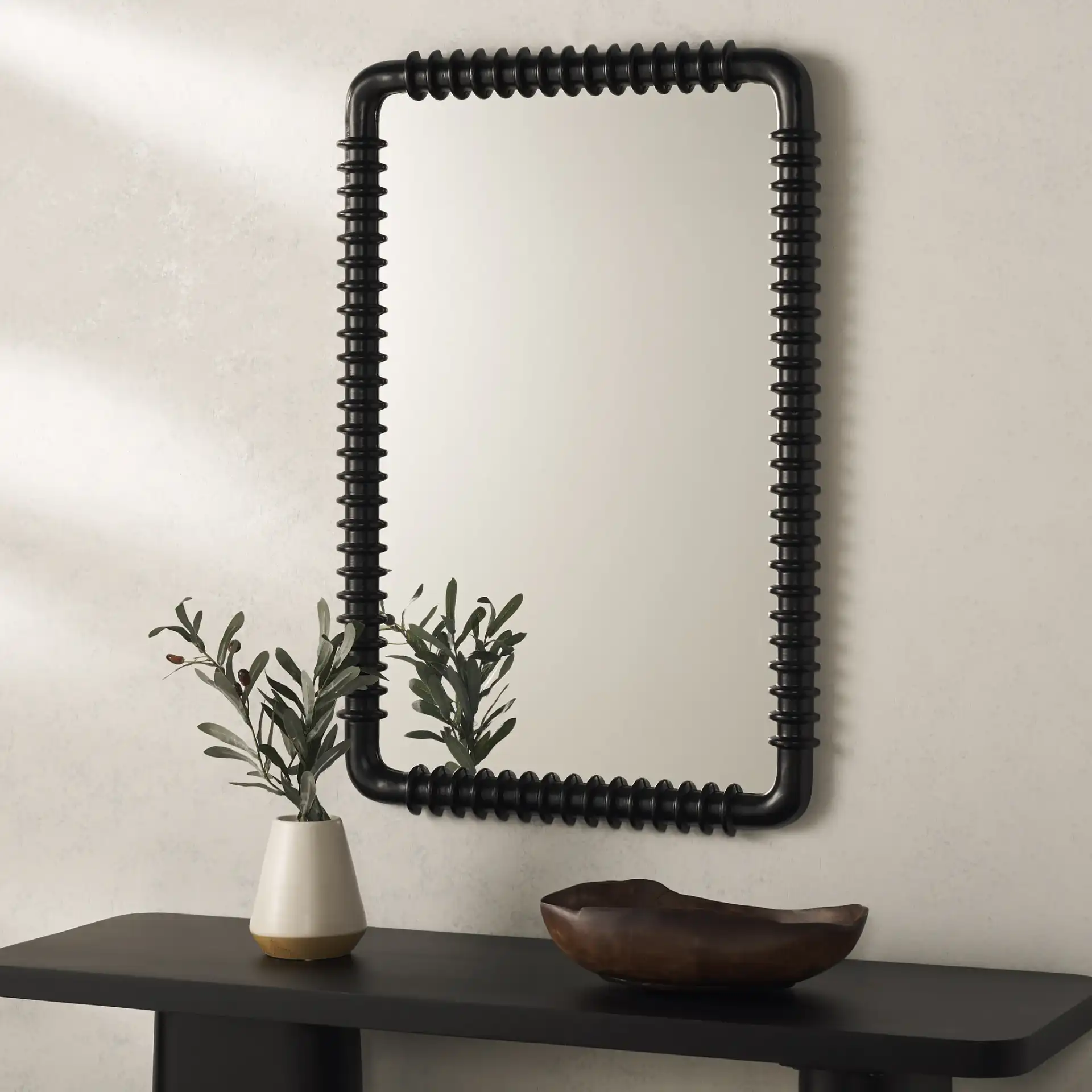 Aria 24-Inch Mirror in Black in a styled room