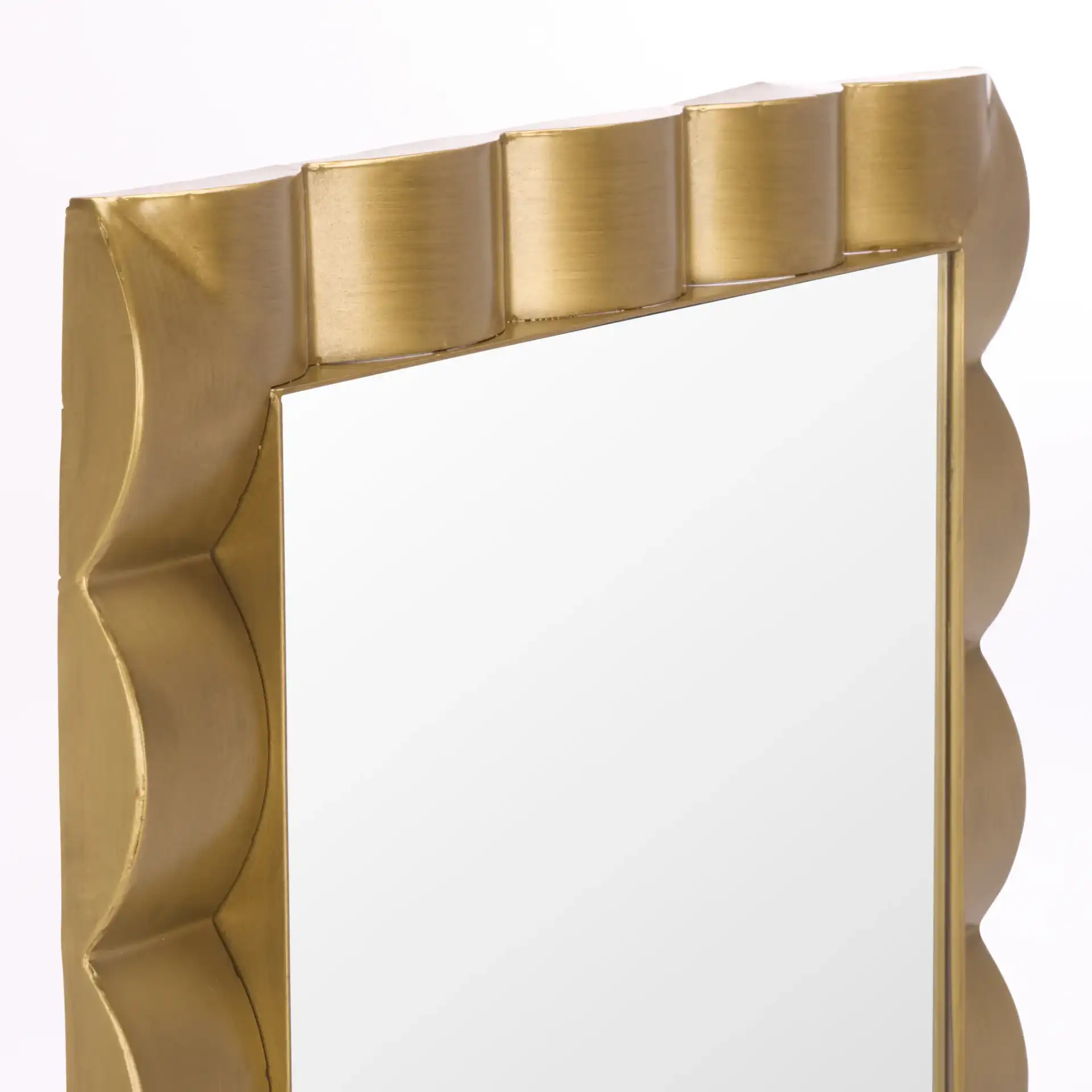 Nira Wall Mirror in Gold in a styled room