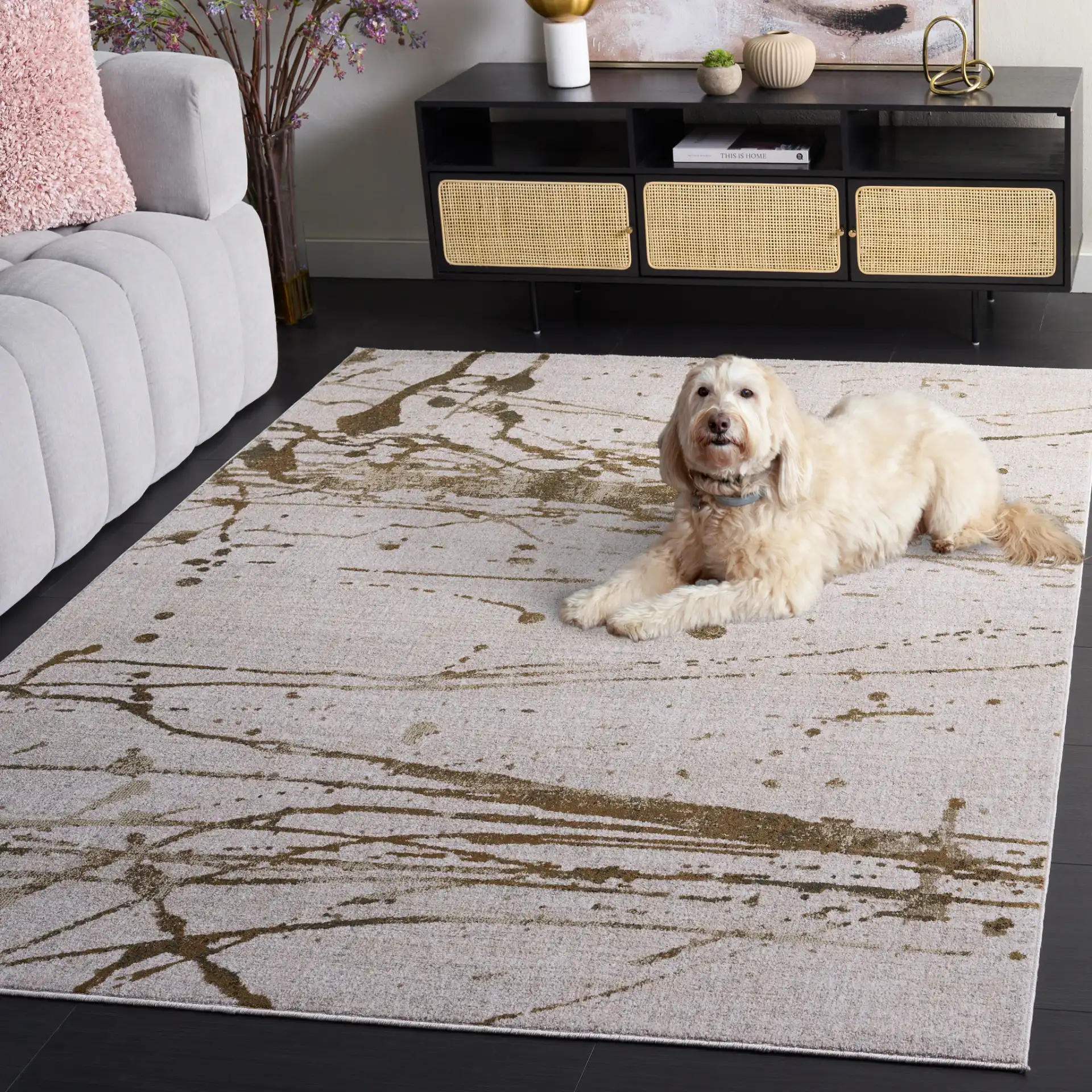Marvel Splatter Abstract Rug in Gray / Beige in a styled room