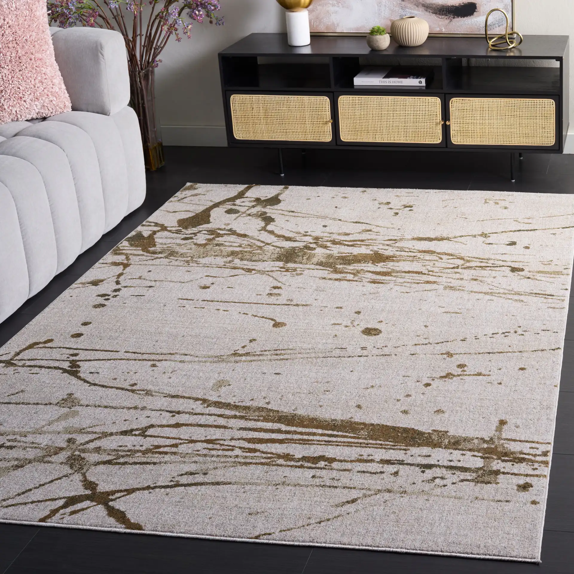 Marvel Splatter Abstract Rug in Gray / Beige in a styled room